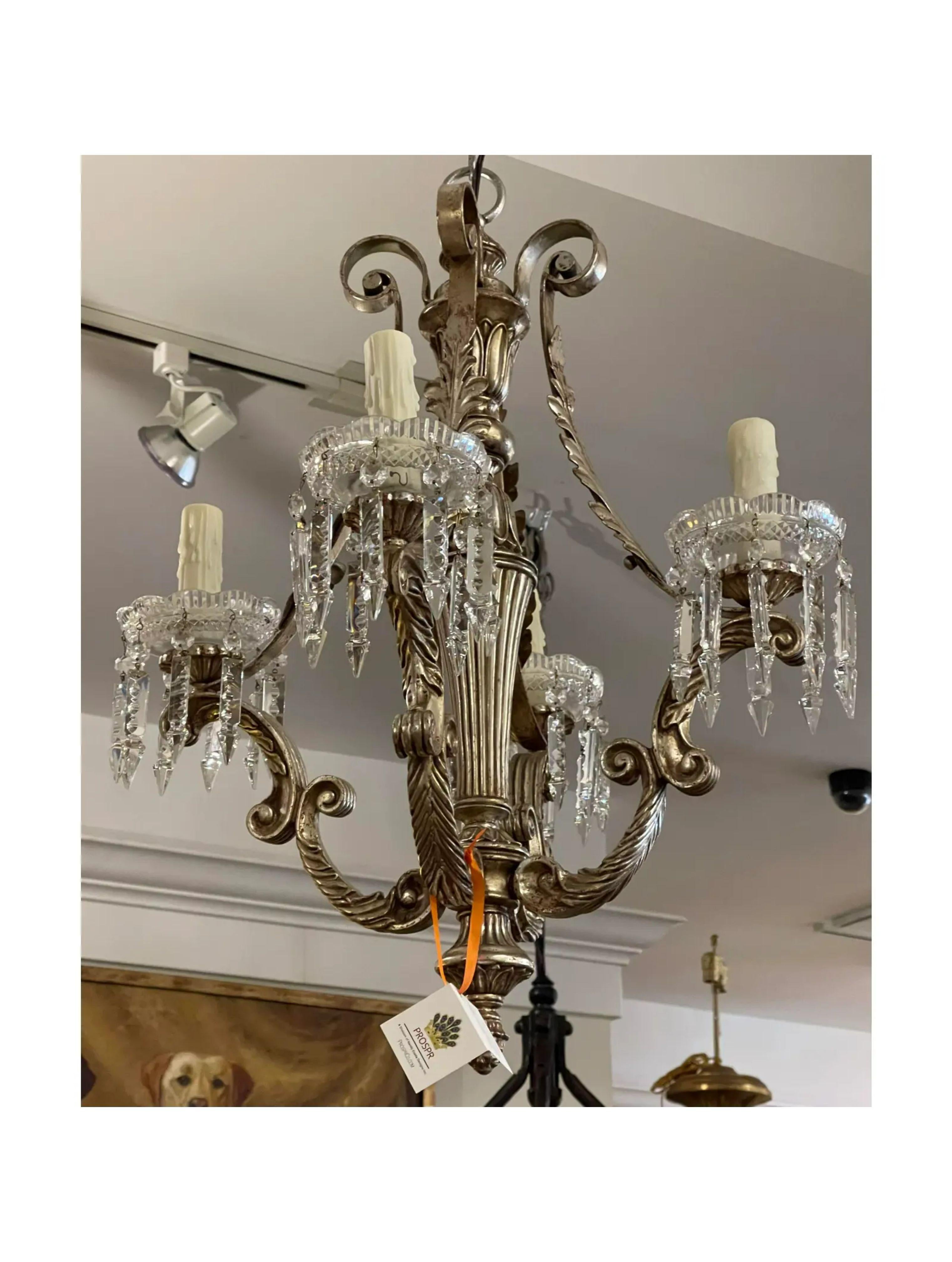 Antique Italian silver gilt metal chandelier. It includes 4 lights with Austrian crystal bobeches and prisms.

Additional information:
Materials: crystal, lights, silver
Color: silver
Period: 1920s
Styles: Italian
Power Sources: Up to 120V