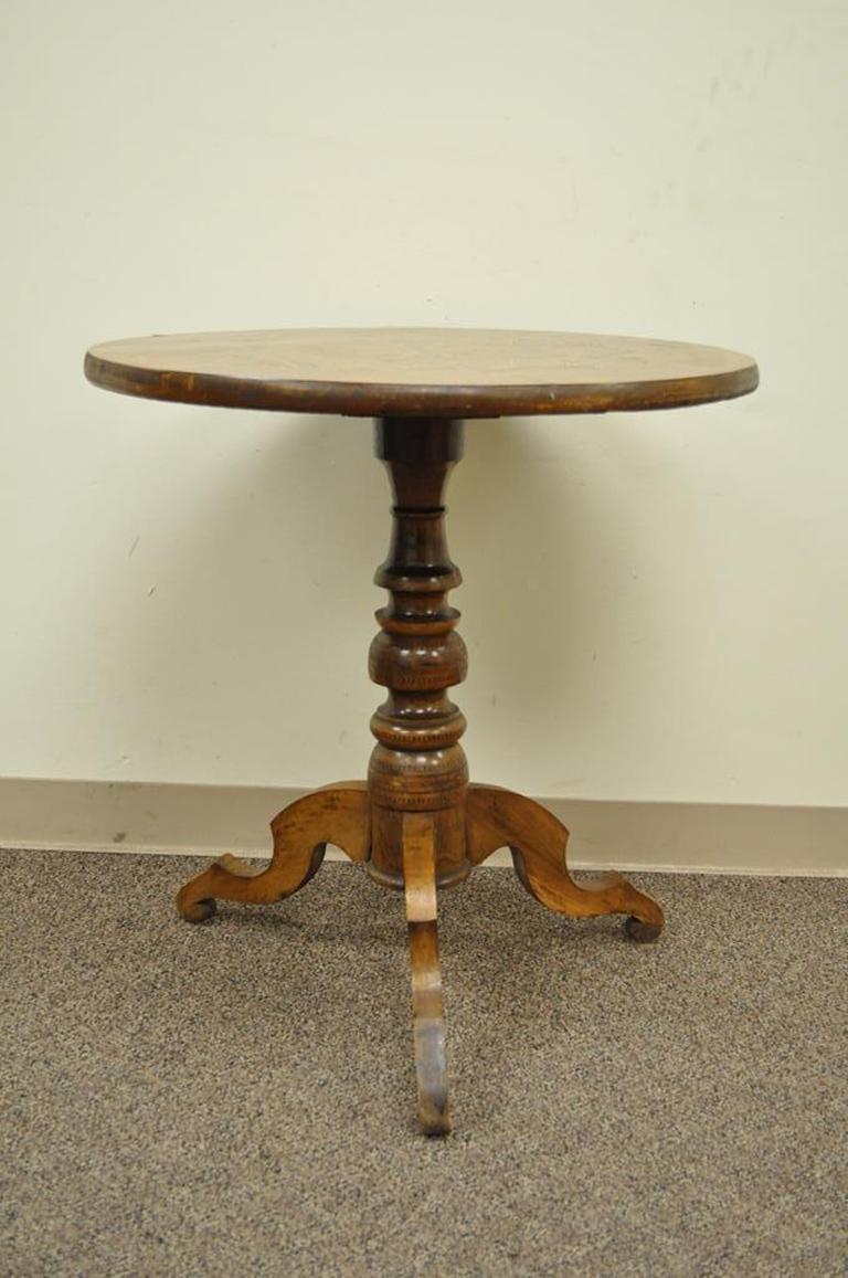 Beautiful antique Italian Sorrentino parquetry inlaid pedestal base table. Item features a very nice parquet inlay along the pedestal base as well as the top, shapely tripod legs, and a sturdy solid wood construction, circa 19th century.