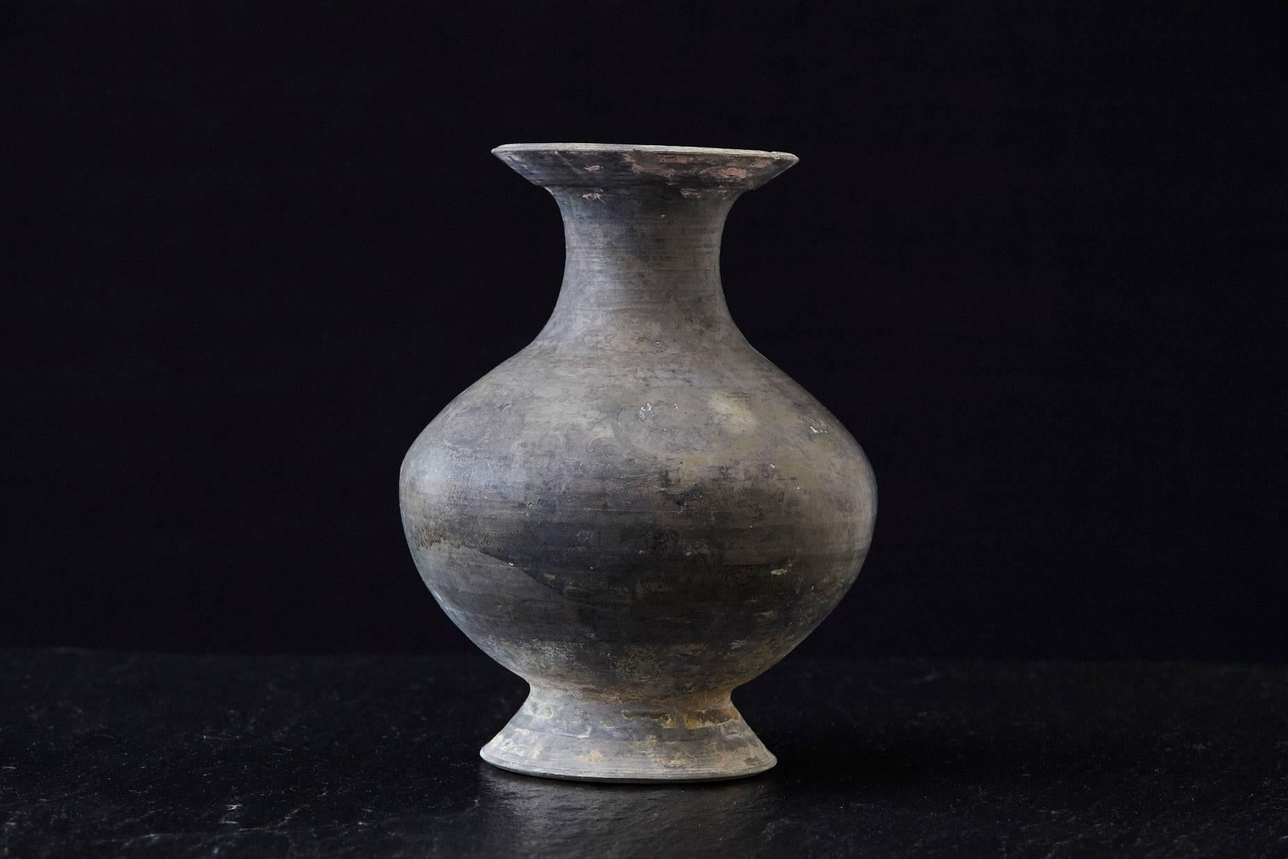 Beautiful antique Italian terra cotta vase with bottle shape in dark grey, fantastic patina. There are a few very old, almost natural chips by now, to the top rim of the vase from usage over the decades, please refer to the photos. From Sardinia,