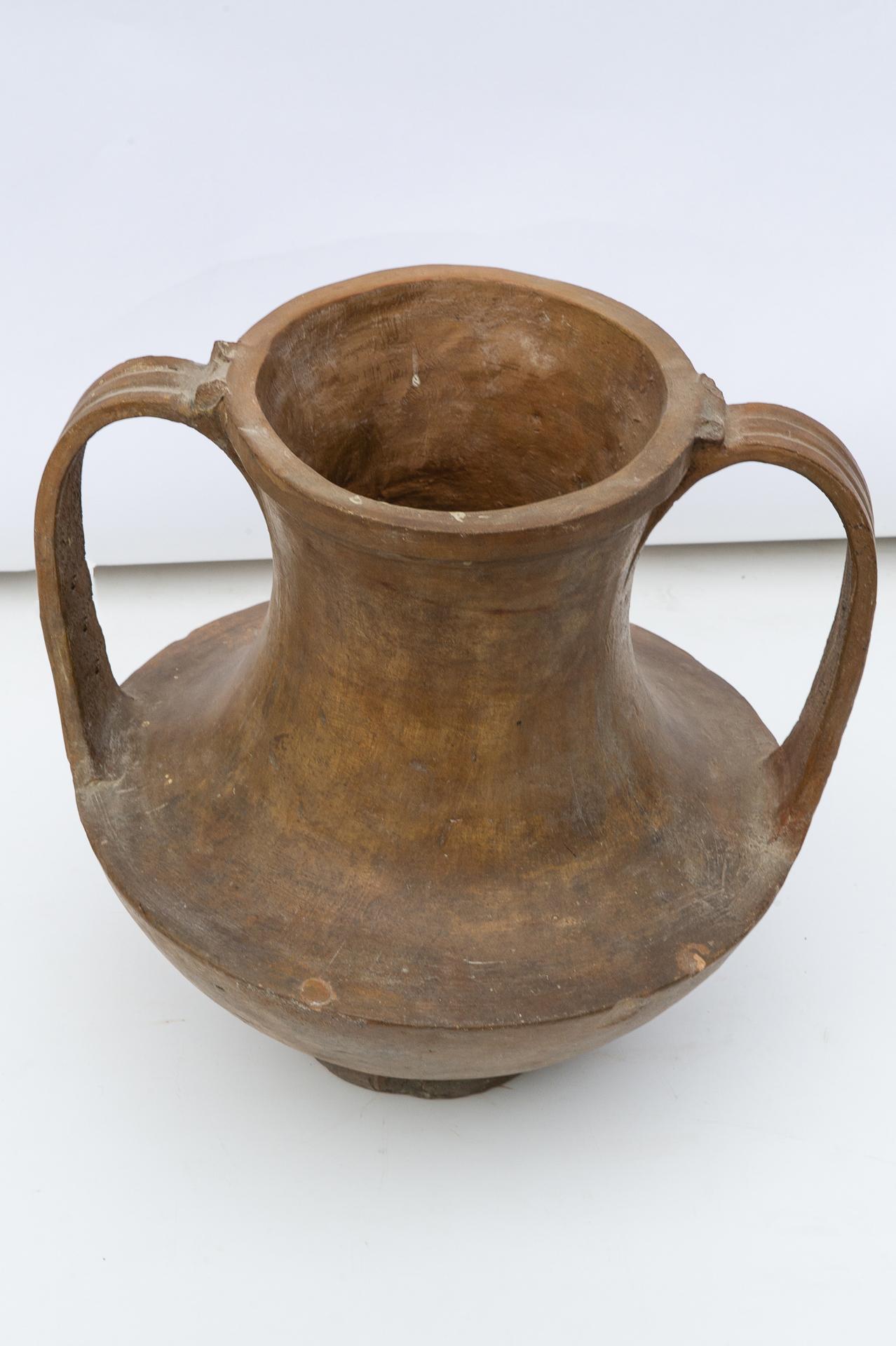 O/3225 -  Antique Italian terracotta amphora with two handles from the Lombard city of Vigevano. Rare to find.
The diameter is 40 cm. (in.21), but with handles iscm. 45.
It's decorative and elegant in its semplicity.