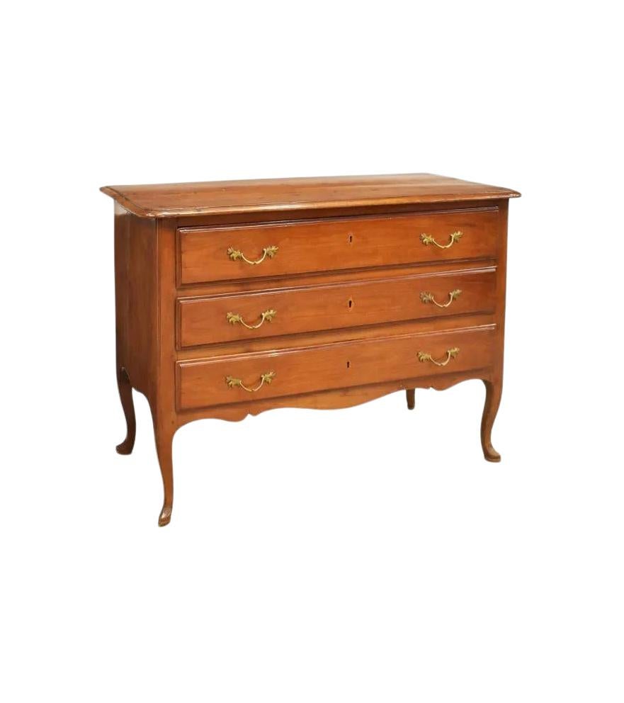 Antique Italian commode from early 19th c. This commode has a lovely, rich patina since it is made of fruitwood.
This chest is fitted with three drawers, rising on cabriole legs, ending in pointed slipper feet, separation at top and side panels. All