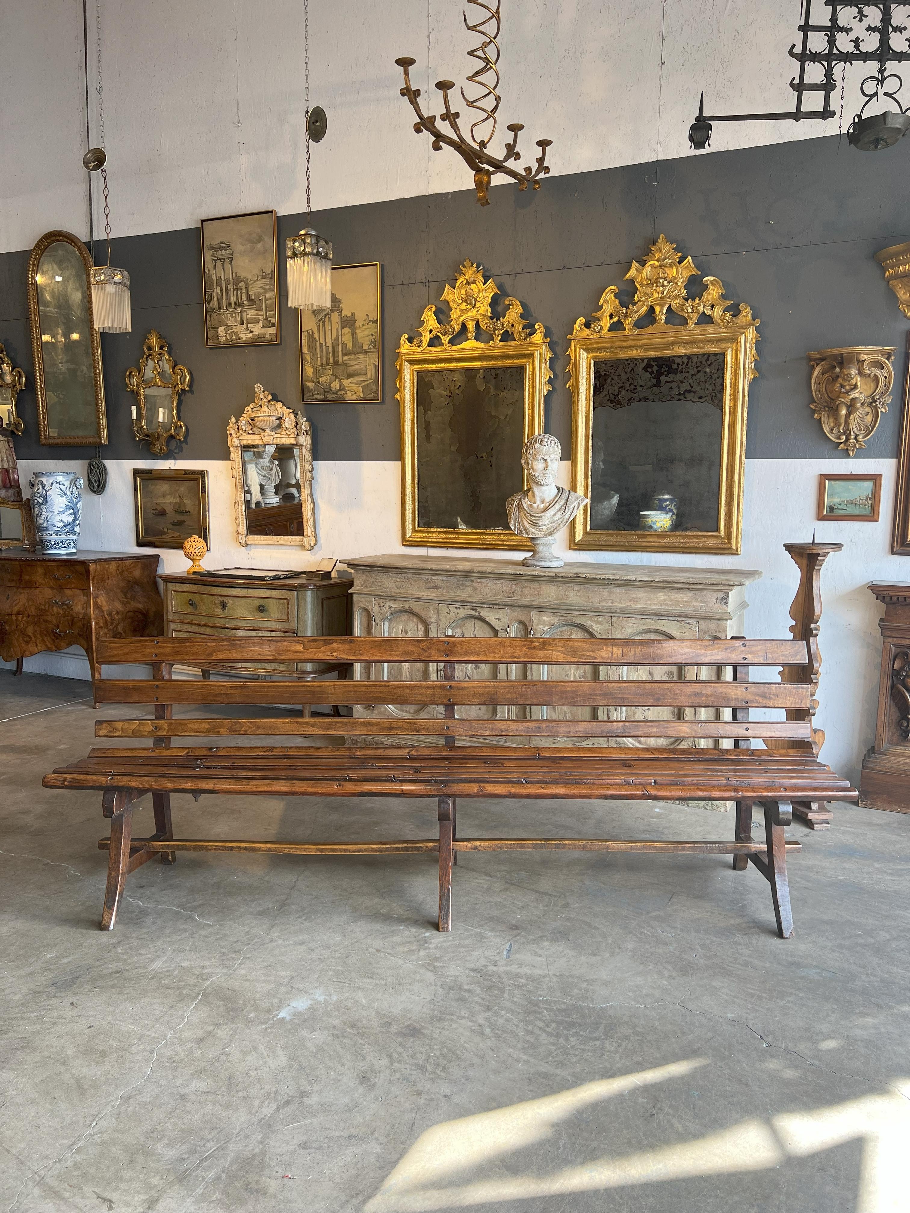 Antique Italian Train Station Long Bench from Torino: 

A Fusion of Wood and Iron the simple beauty of Italian craftsmanship finds its expression in this Train Station Bench from Torino. Crafted entirely from wood and iron bolts, this remarkable