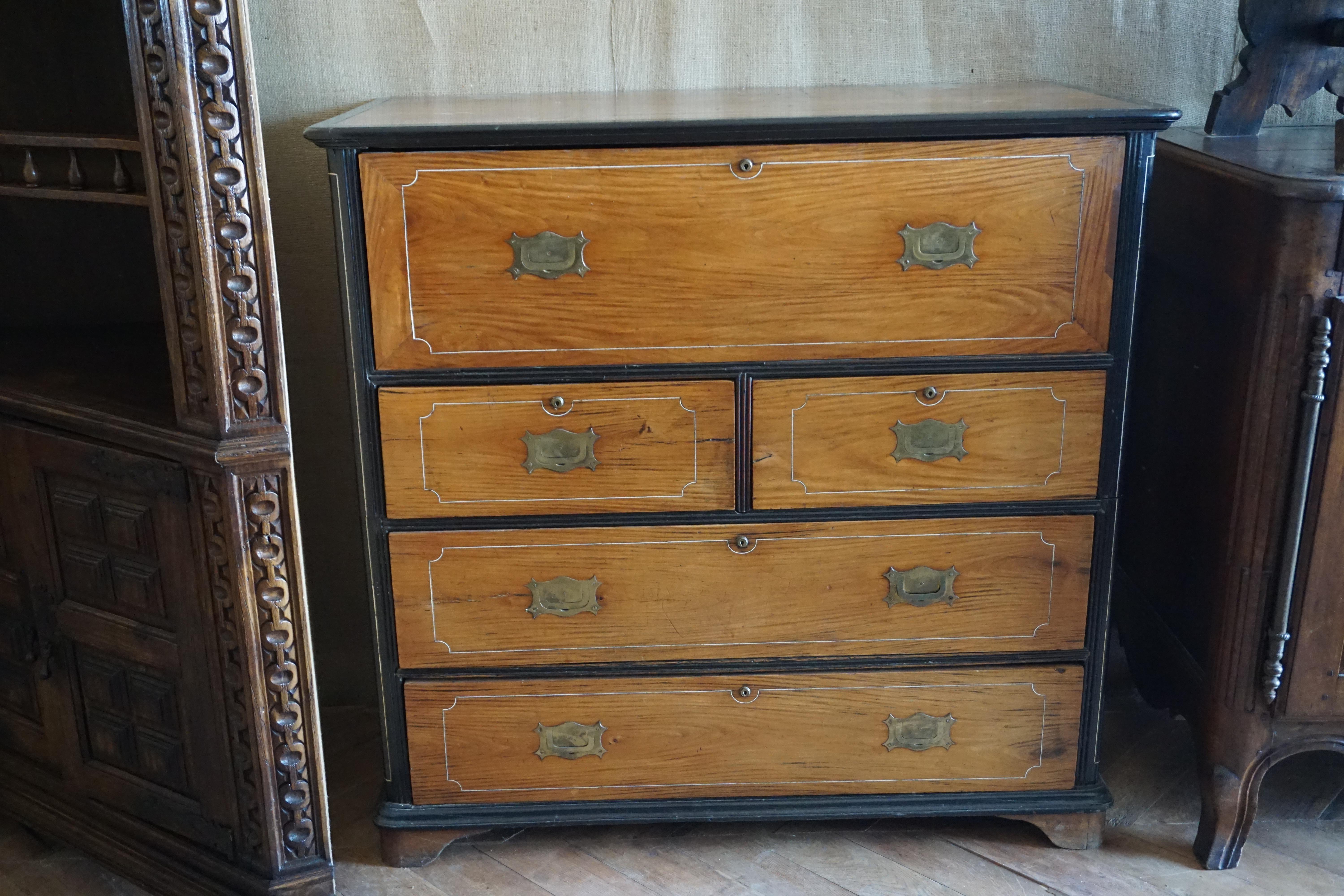 This travel trunk features an antique charm, as it unfolds into a desk and storage case. Originating from Italy, circa 1860. Faded mahogany 2-part campaign chest with wide string inlaid ebonized moldings, the top slide out drawer with drop front