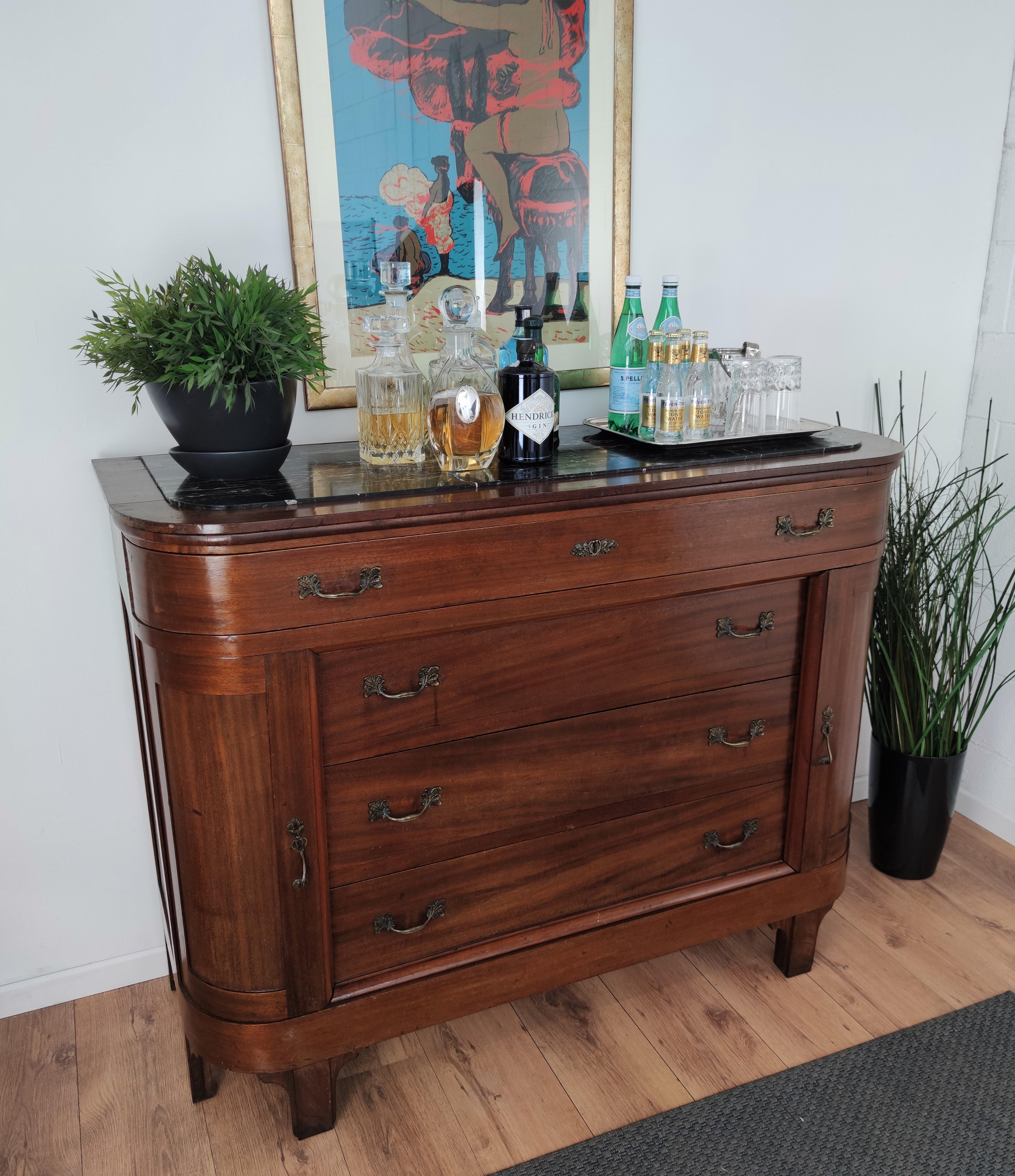 Very elegant Italian Art Deco Mid-Century Modern chest of drawers, commode cabinet, in beautiful veneer walnut wood, two side doors, 4 drawers and decorated handles with black Portoro marble top. Portoro is a high-quality black marble, where the