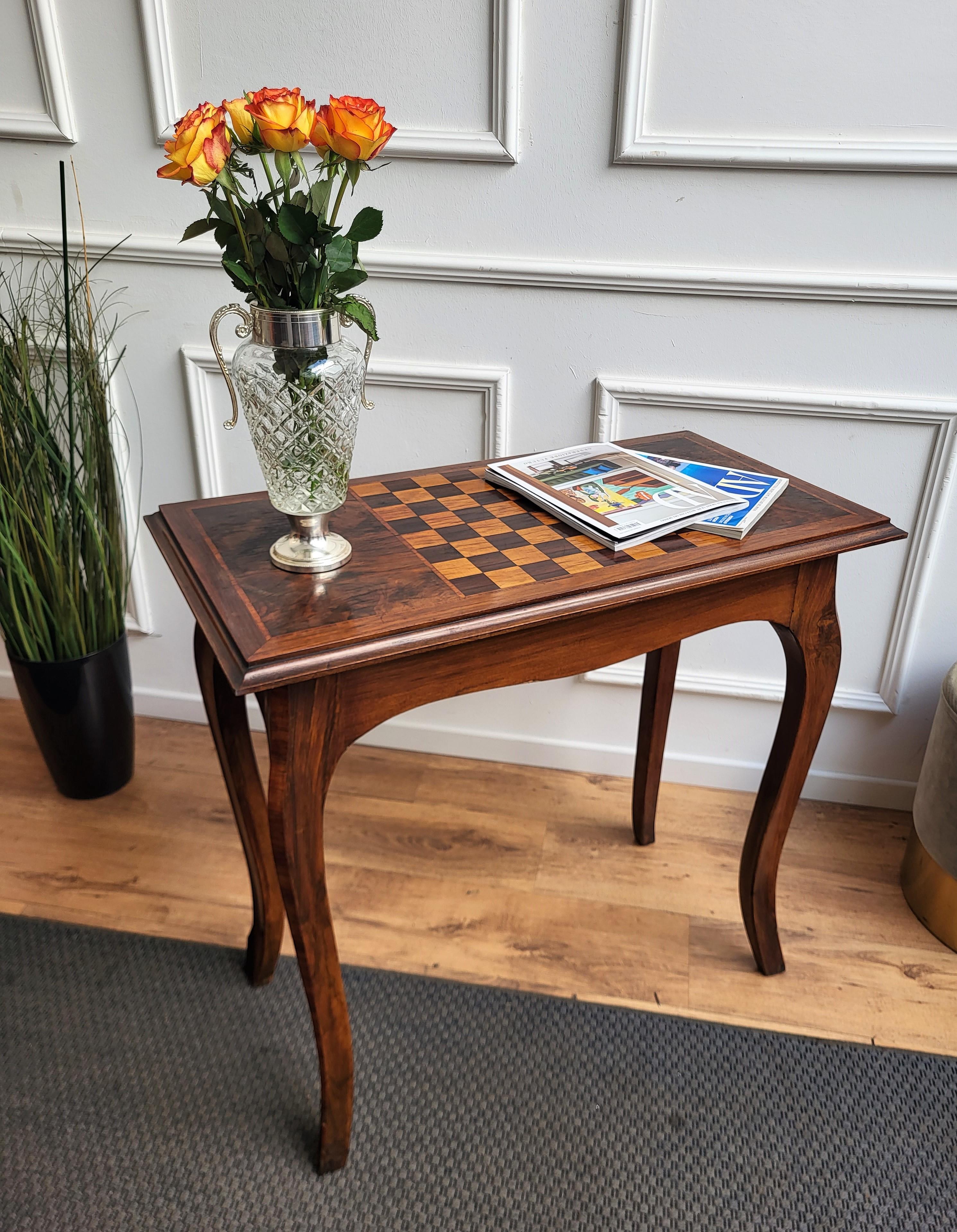 Beautiful antique Italian solid walnut games side table with inlay chess game, central drawers and beveled edges over four beautiful walnut cabriole legs with inlay decorated wood and brass finals. This Italian walnut side table with the rich and