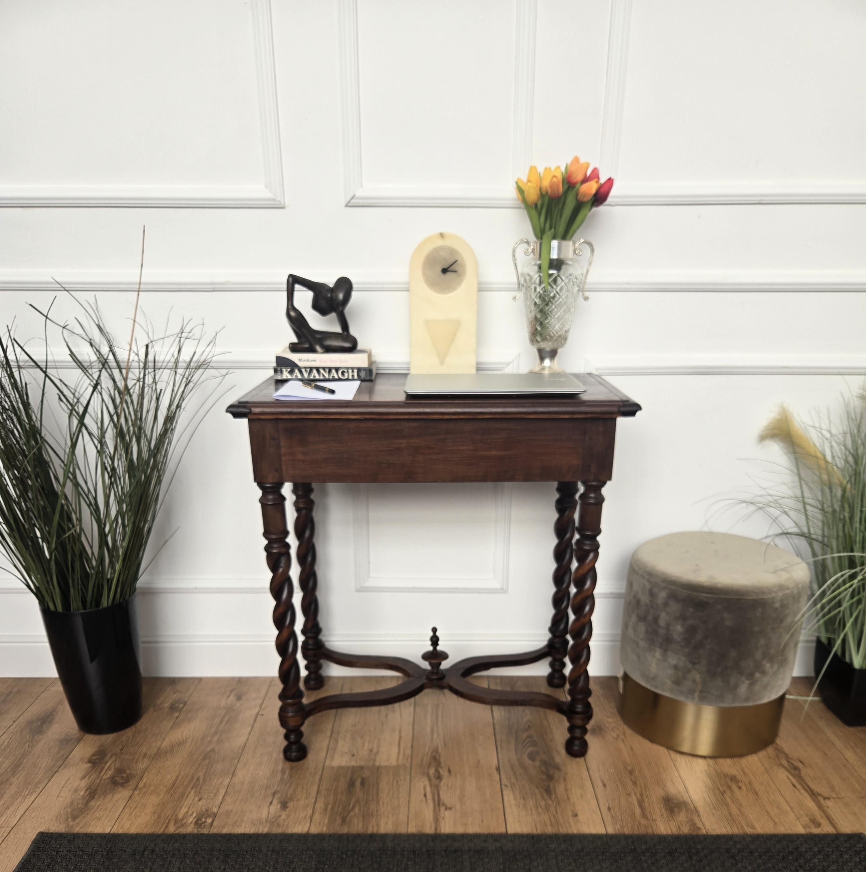 Beautiful antique Italian solid walnut side table console desk with four beautiful walnut carved legs connected to one another with central decorated stretchers and detailed by the beveled top. This Italian walnut side table with the rich and