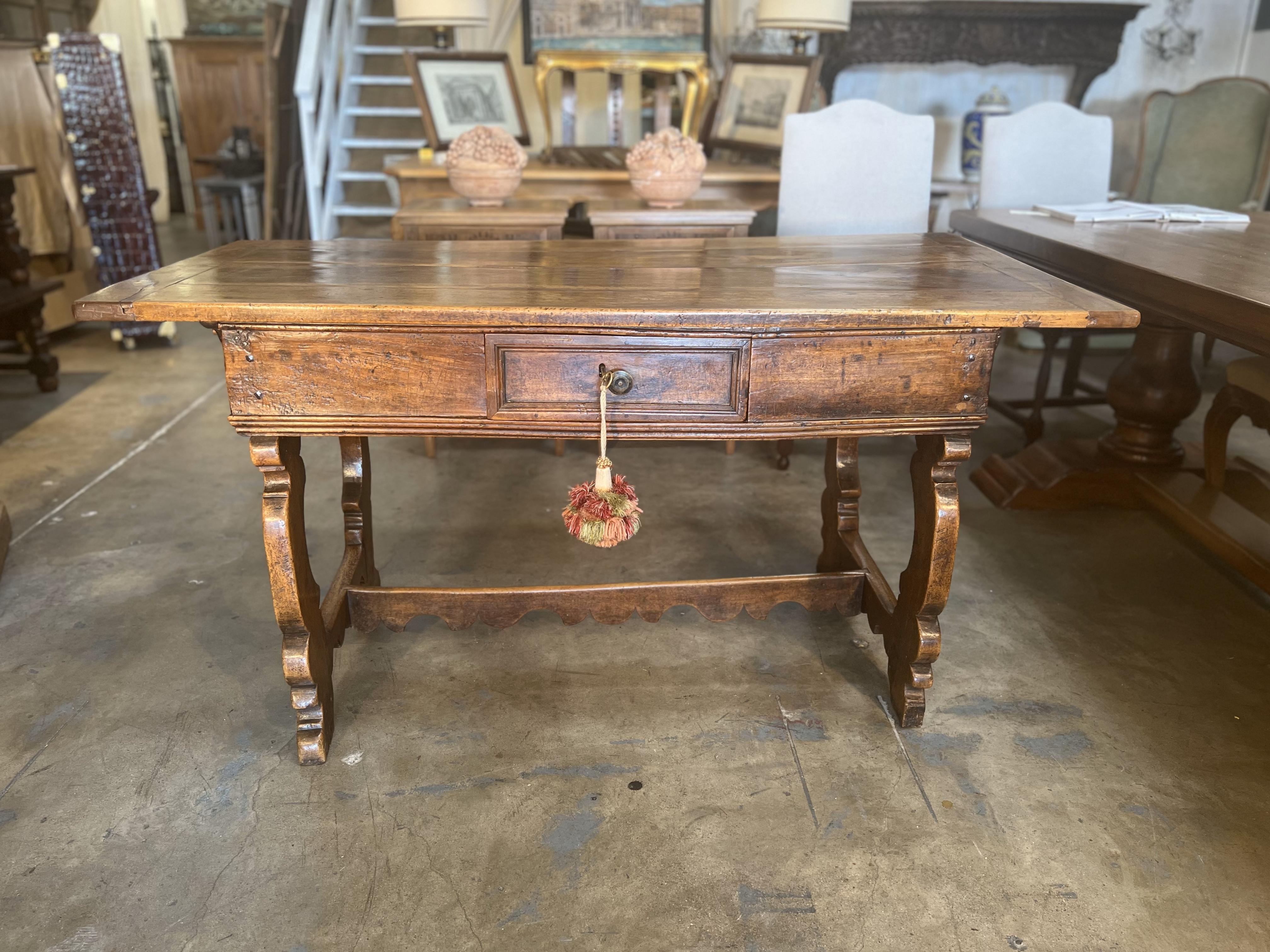 This is an original Italian Antique desk built in Central Italy, Emilia or Tuscany in the Mid-17th Century made of solid walnut with wood nails joining the planks.

Measures: 61.5