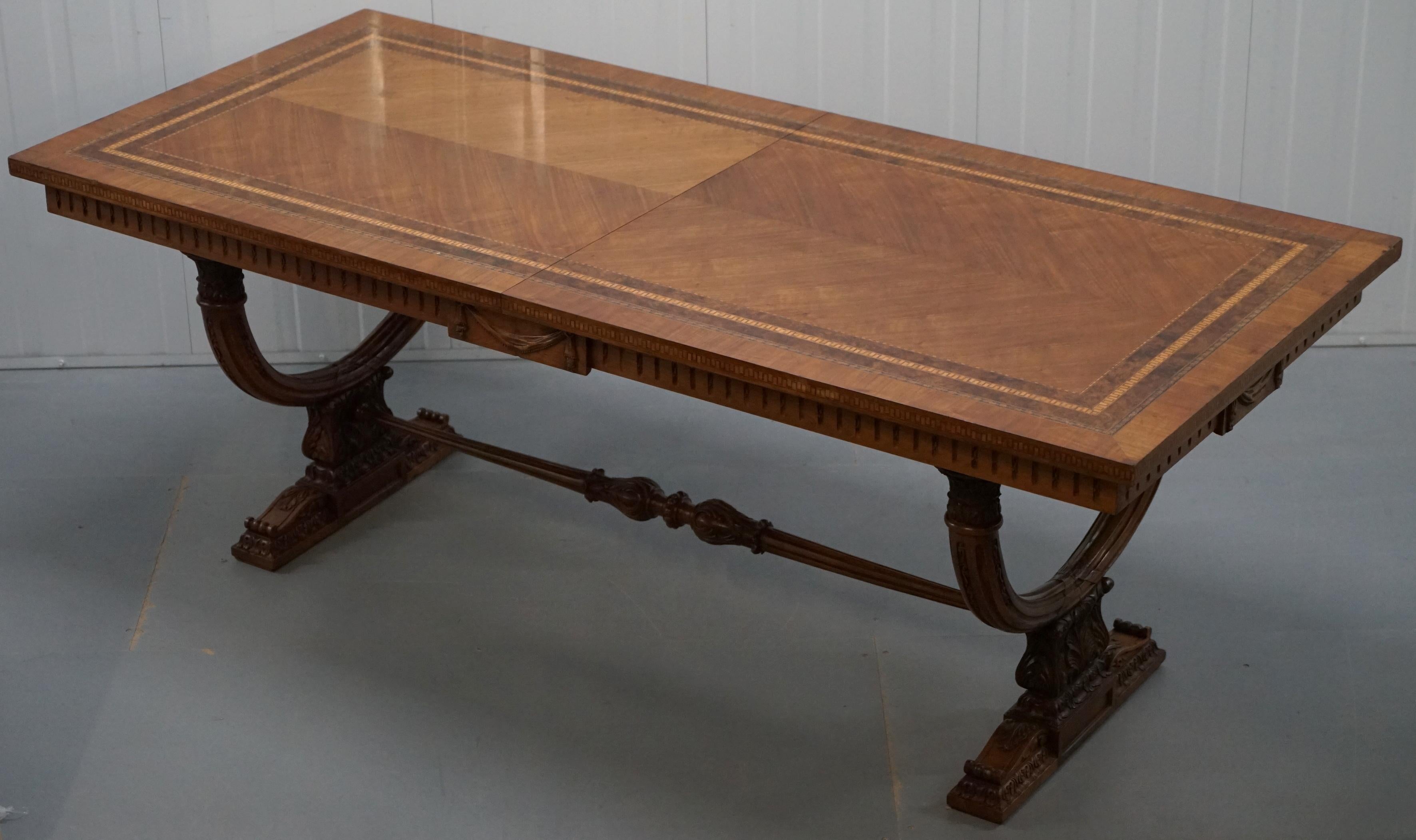 We are delighted to offer for sale this absolutely stunning handmade in Italy antique extending dining table with Roman Empire style carved detailing throughout

A very good looking and well-made table, dated to the 19th century, the walnut top is