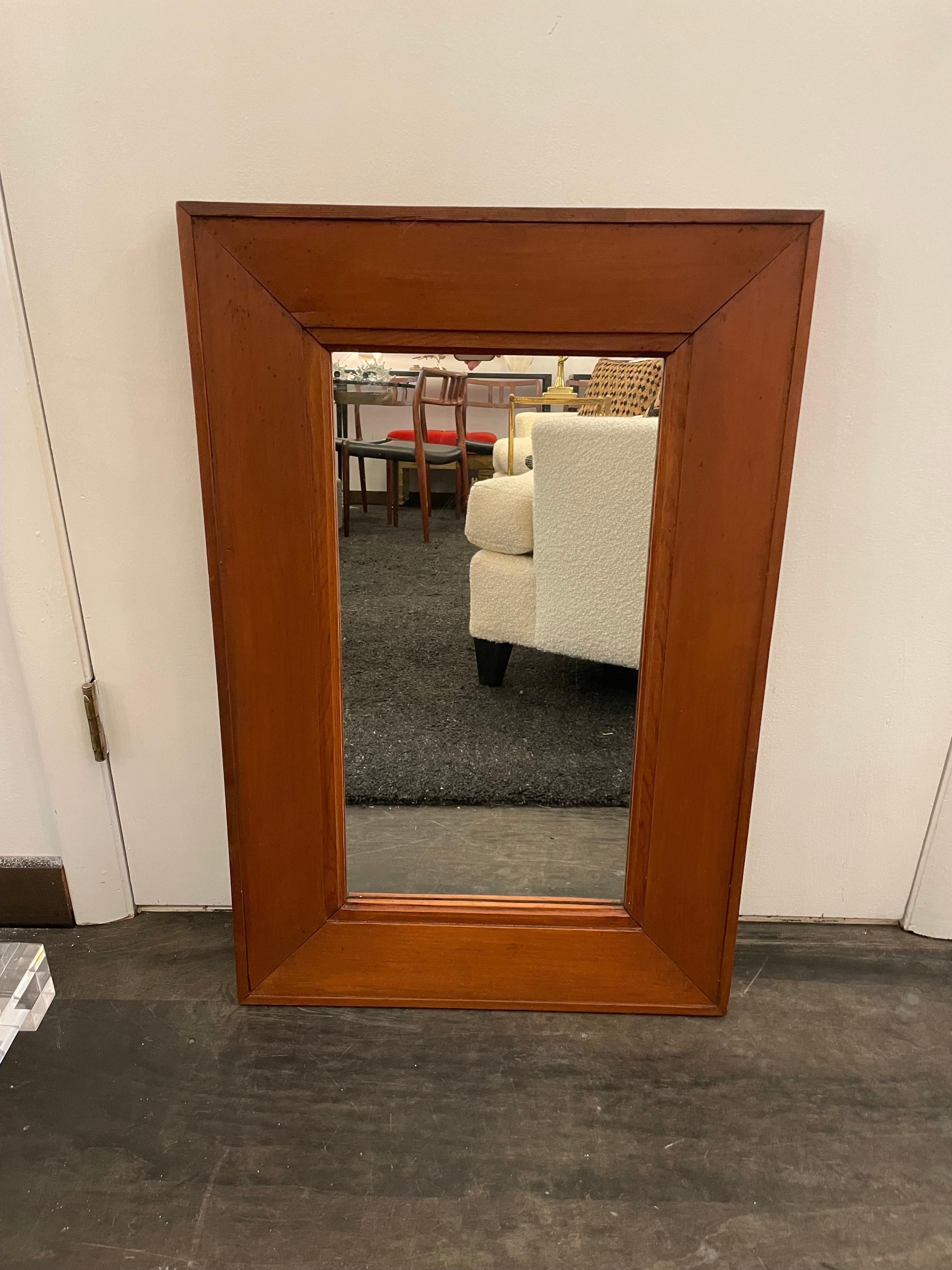A simple and elegant Italian walnut wall mirror with a tiered wood frame. ALL original and in wonderful aged condition.