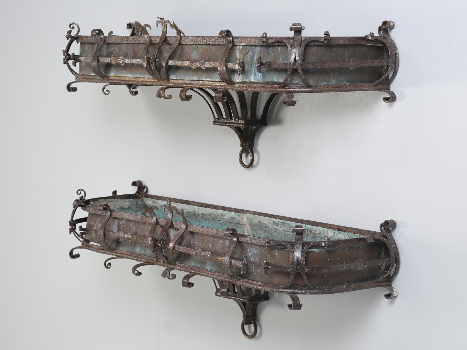 Antique Italian window boxes (pair) made of copper and hand formed metal. They are very unusual and are the only exceptional antique window boxes we have ever had for sale. To find a pair of antique Italian window boxes, this great looking is almost