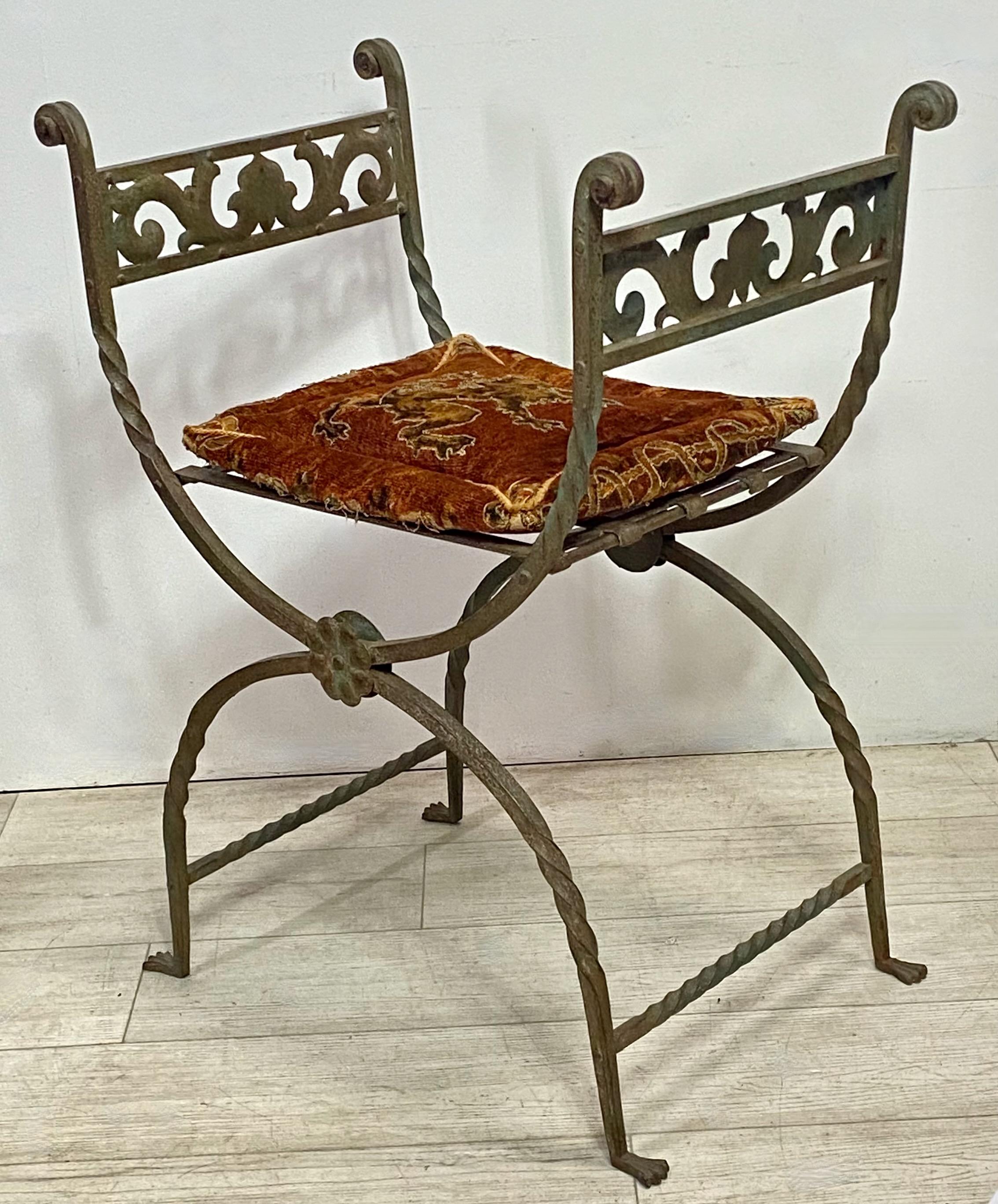 Beautifully hand crafted wrought iron Curule or Savonarola style chair or stool with original patinated green paint and original velvet cushion with lion appliqué.
Very good quality and in excellent condition.
Italy, 19th century.