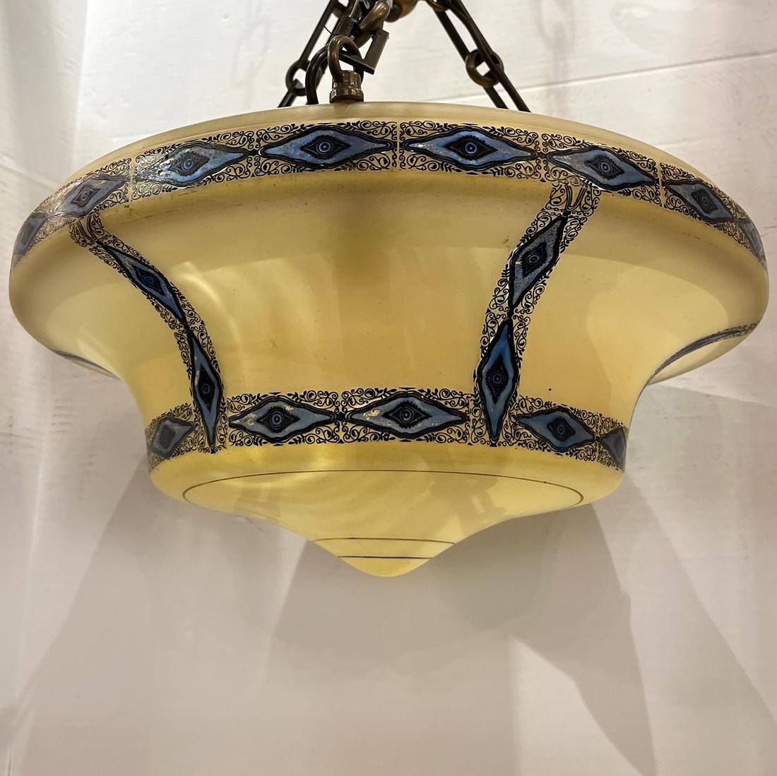 A circa 1920's Italian glass light fixture with blue details. 3 interior lights.

Measurements:
Height: 16.5