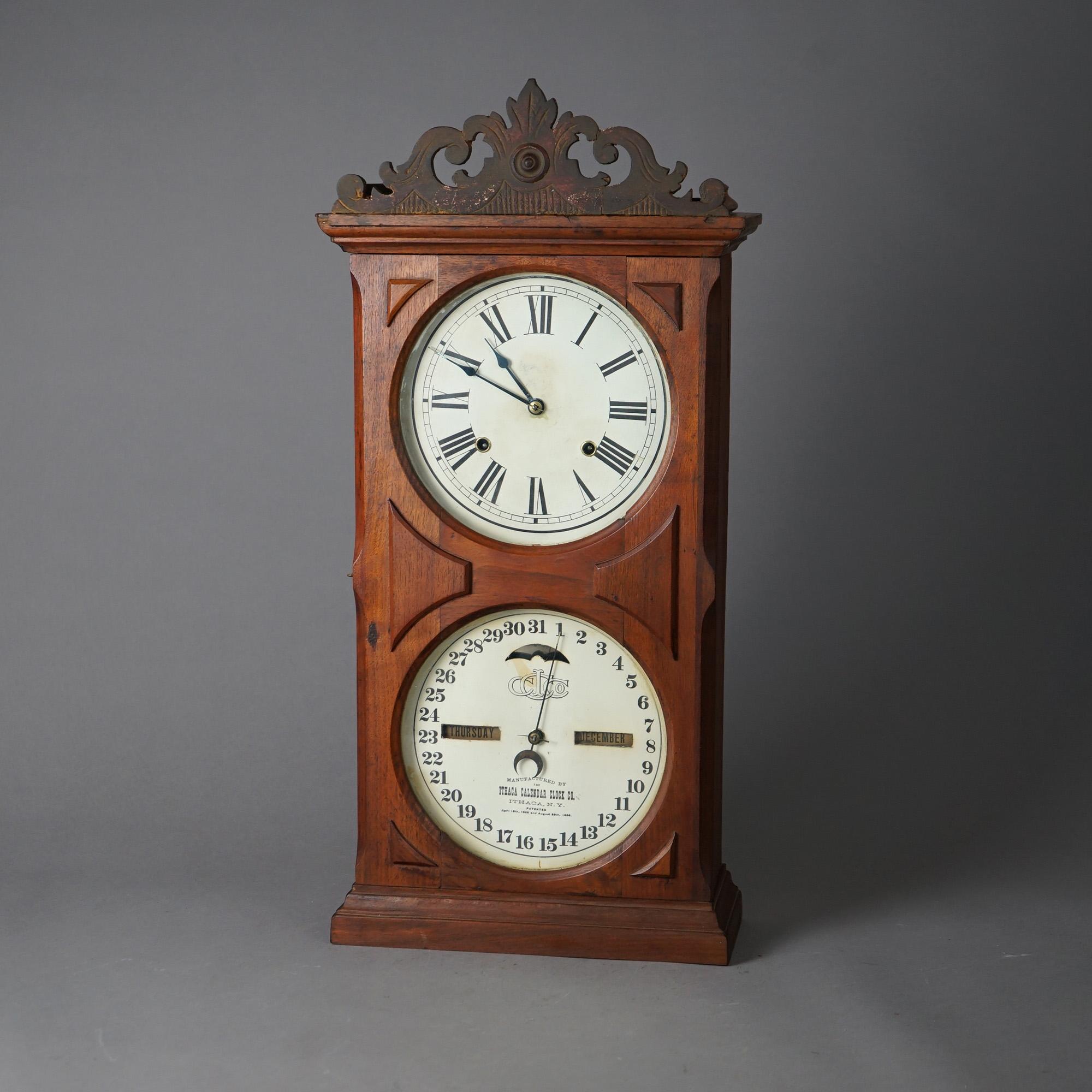 An antique mantel calendar clock by Ithaca offers walnut case with double dials including upper time dial and lower date dial, c1866

Measures - 26
