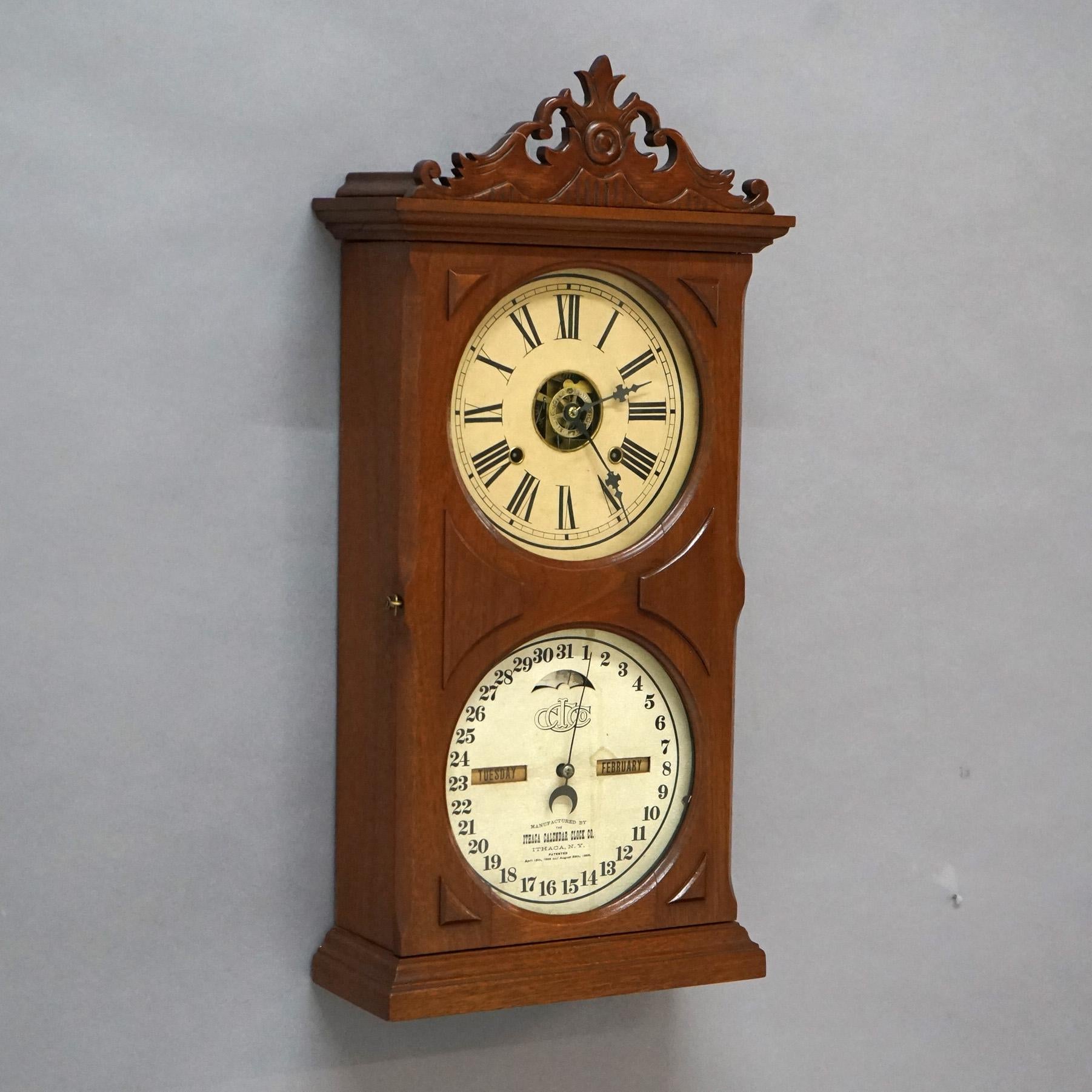 Antique Ithaca Walnut Double Dial Calendar Mantle Clock with Carved Crest C1866

Measures- 25.75''H x 12.5''W x 5''D