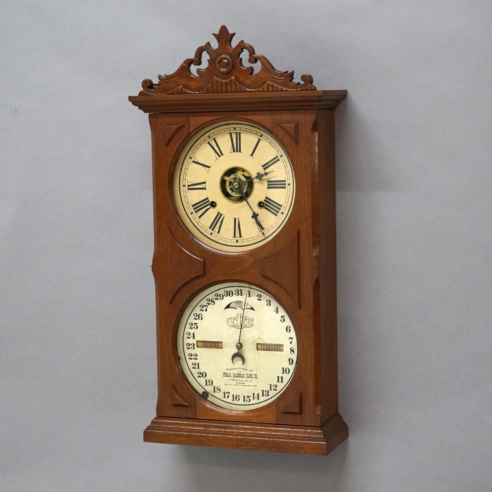 American Antique Ithaca Walnut Double Dial Calendar Mantle Clock with Carved Crest C1866