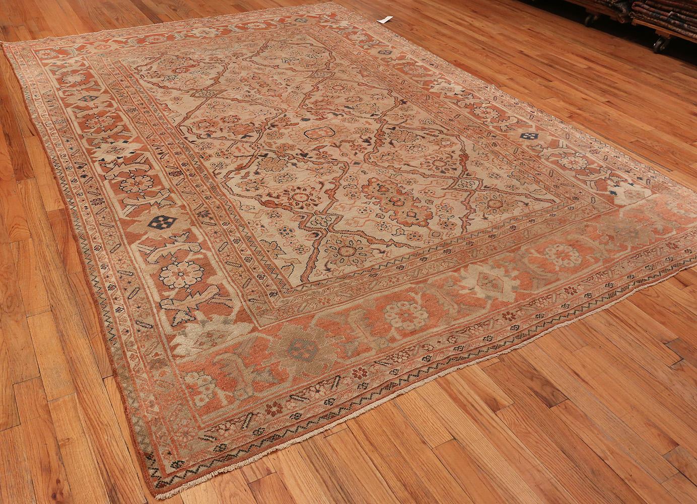 Antique Ivory Background Persian Sultanabad Rug, Country Of Origin: Persia, Circa Date: Late 19th Century. Size: 8 ft 10 in x 12 ft (2.69 m x 3.66 m)

This antique Persian rug, a beautiful antique Sultanabad rug, features a central ivory field with