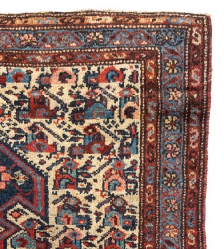 This is a lovely hand knotted antique ivory navy blue Persian Malayer rug from the 1900-1910s measuring 3.3 x 6 ft.

Antique Malayer rugs were woven in the small town of Malayer, located south of Hamedan on the road to Arak. The location in