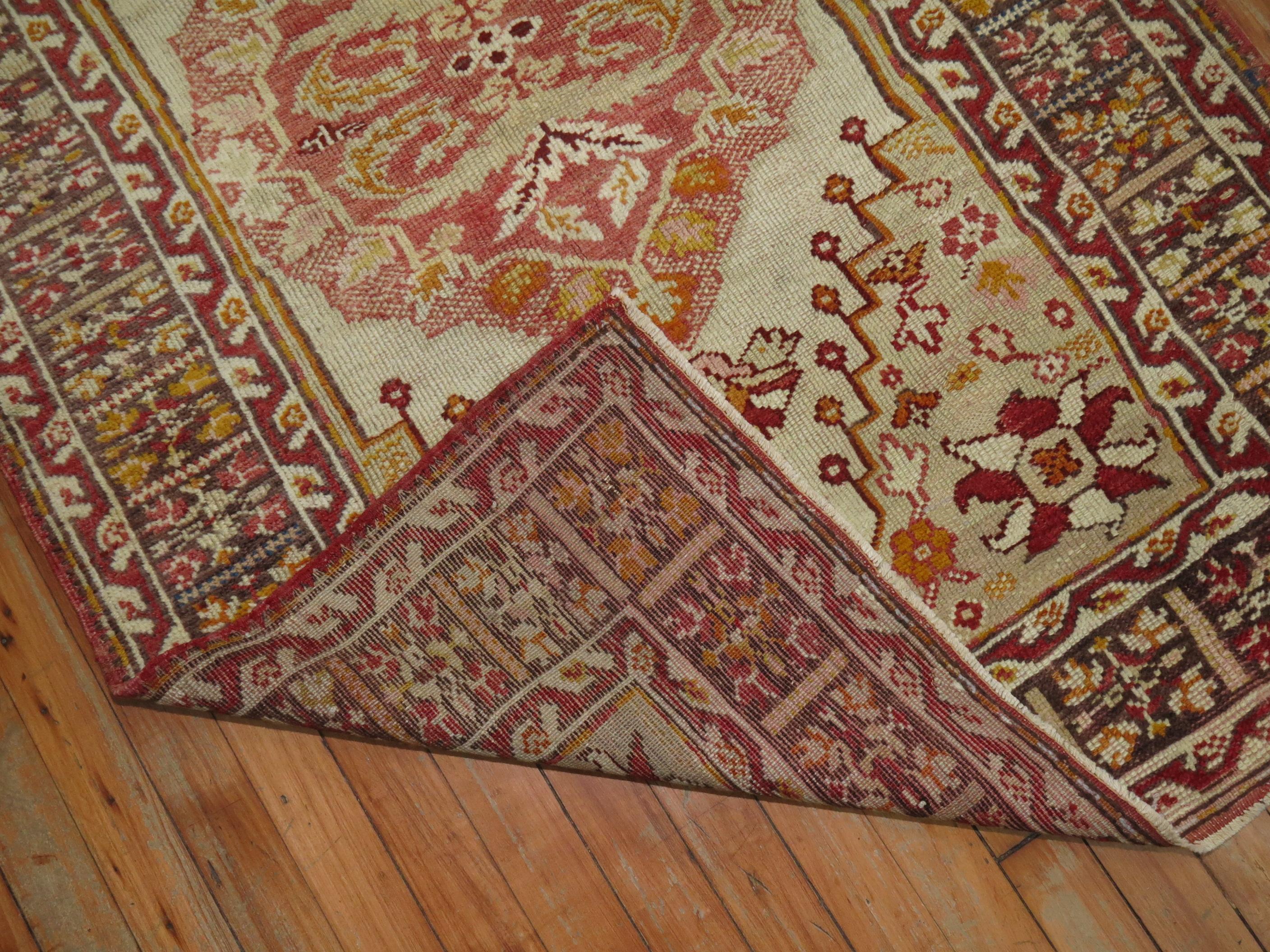 An early 20th century scatter size turkish Rug. Ivory, red, brown and camel

Measures: 3'3'' x 4'9''.
 
