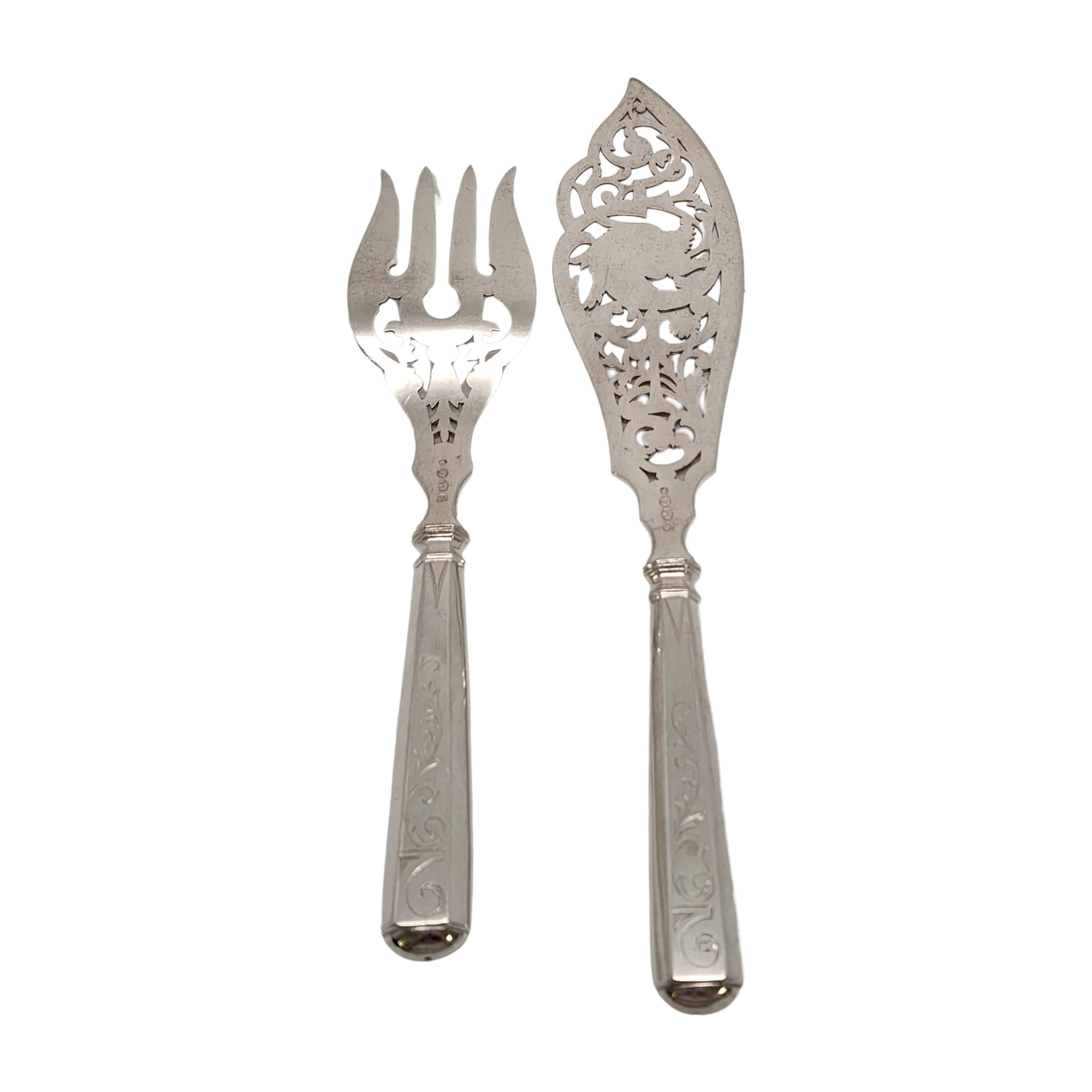 Antique Dutch 833 silver fish serving fork and knife set by KA van Kempen, circa 1887.

No monogram

The set designed by JM van Kempen are beautifully ornate with pierced and etched tines and blade. The handles feature etched swirl designs and a