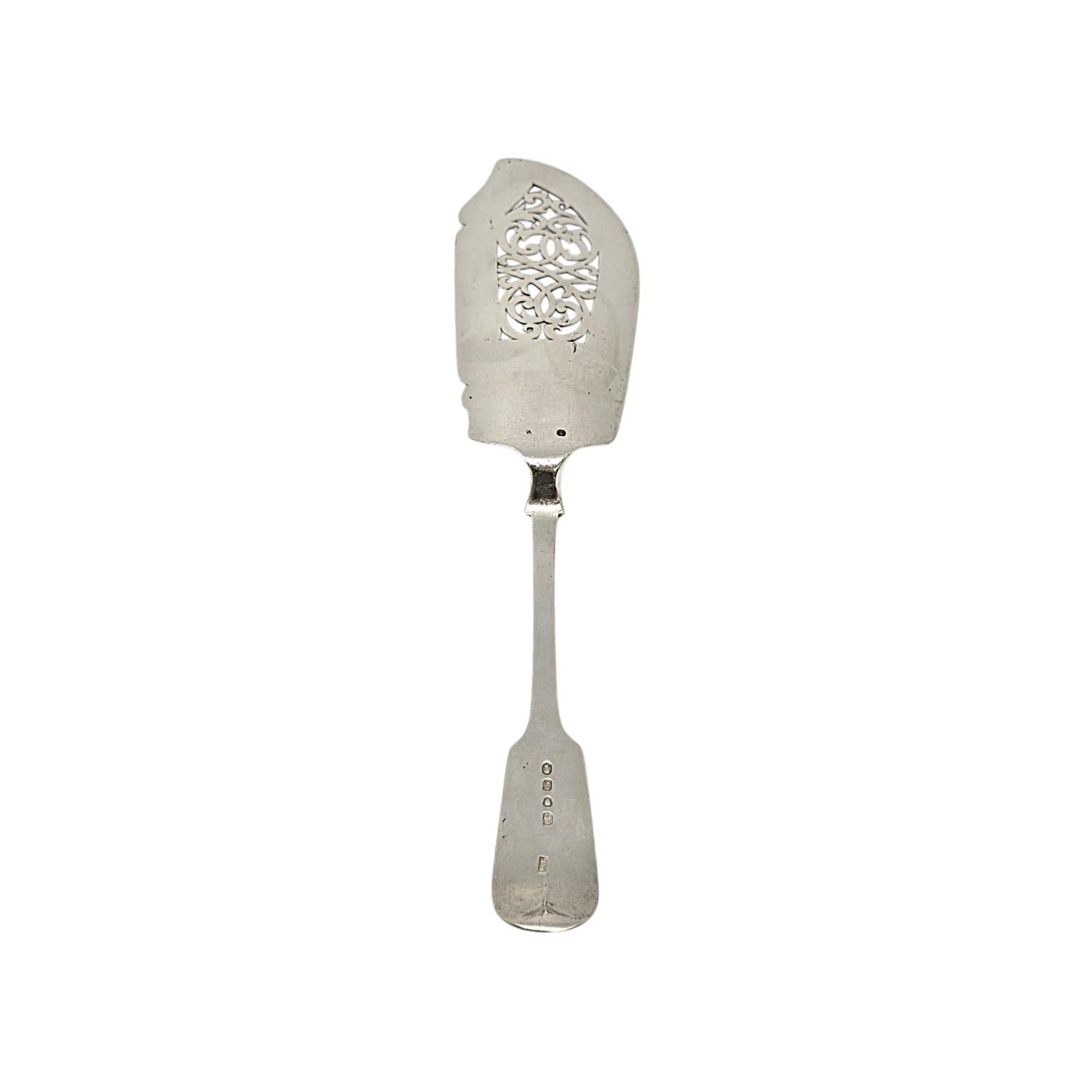 Antique sterling silver fish server by Jacob White of London, England, circa 1844.

No monogram

A large and substantial piece, this fiddle pattern fish server features an open-work scroll design on the blade.

Measures approx 12 1/2