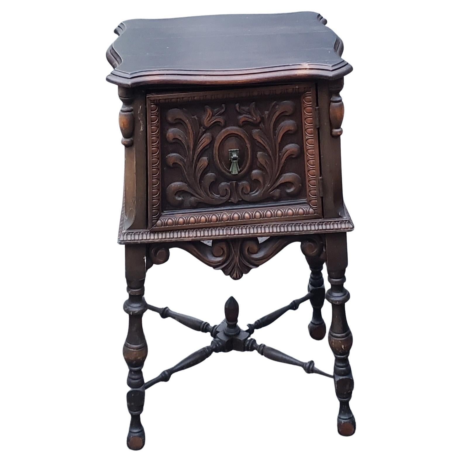 1920sth century Jacobean Revival carved walnut side table, with carved and bobbin turned legs and door,
Antique Jacobean Carved Walnut Side Table Nightstand with Copper Lining. Fine carvings. 
Very good condition
Measure 15
