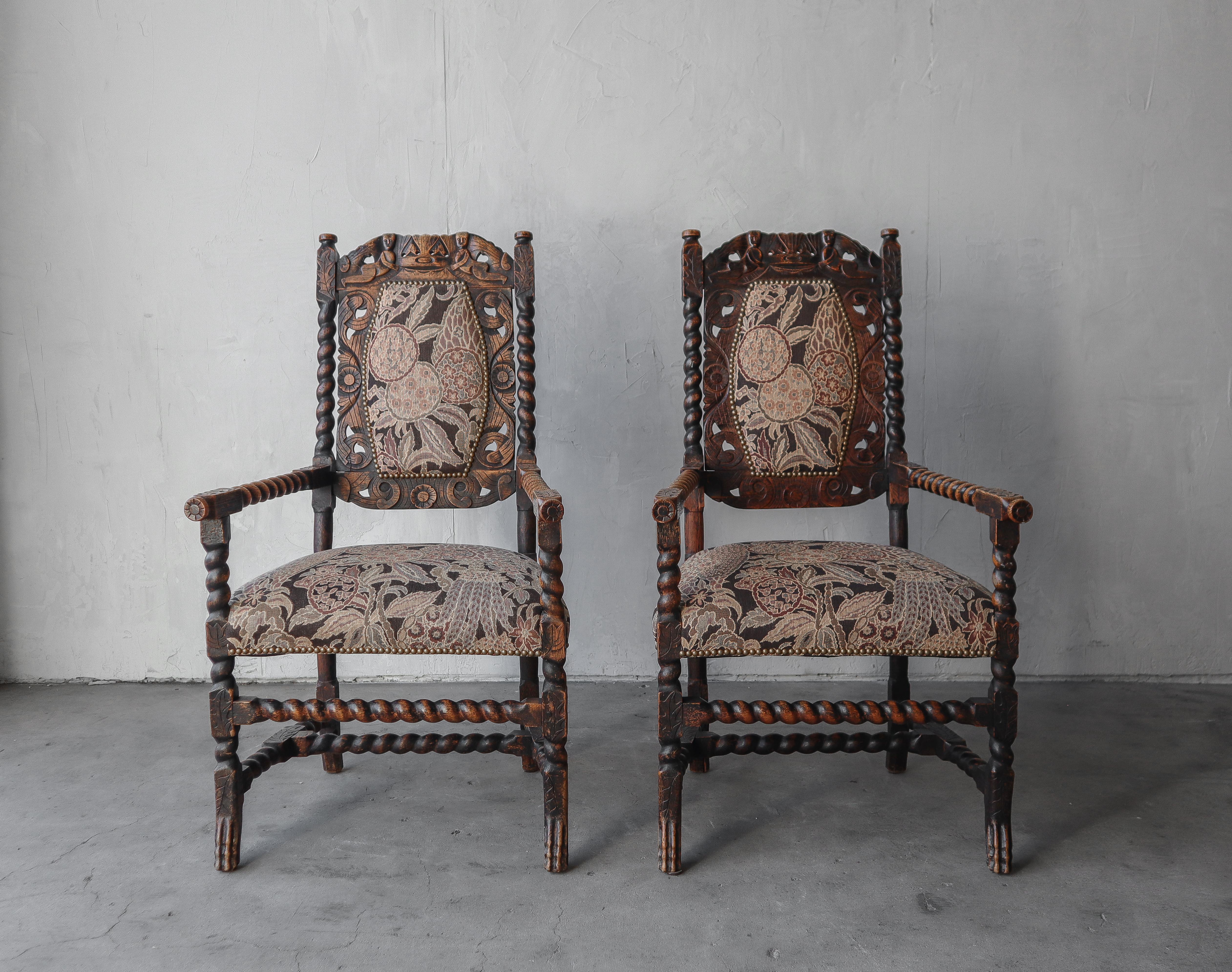 Exquisite pair or antique carved wood occasional arm chairs. Chairs feature incredible carved details making for lots of interest. 

The chairs are in excellent antique condition. The wood shows wear to the finish but it adds to the look and depth
