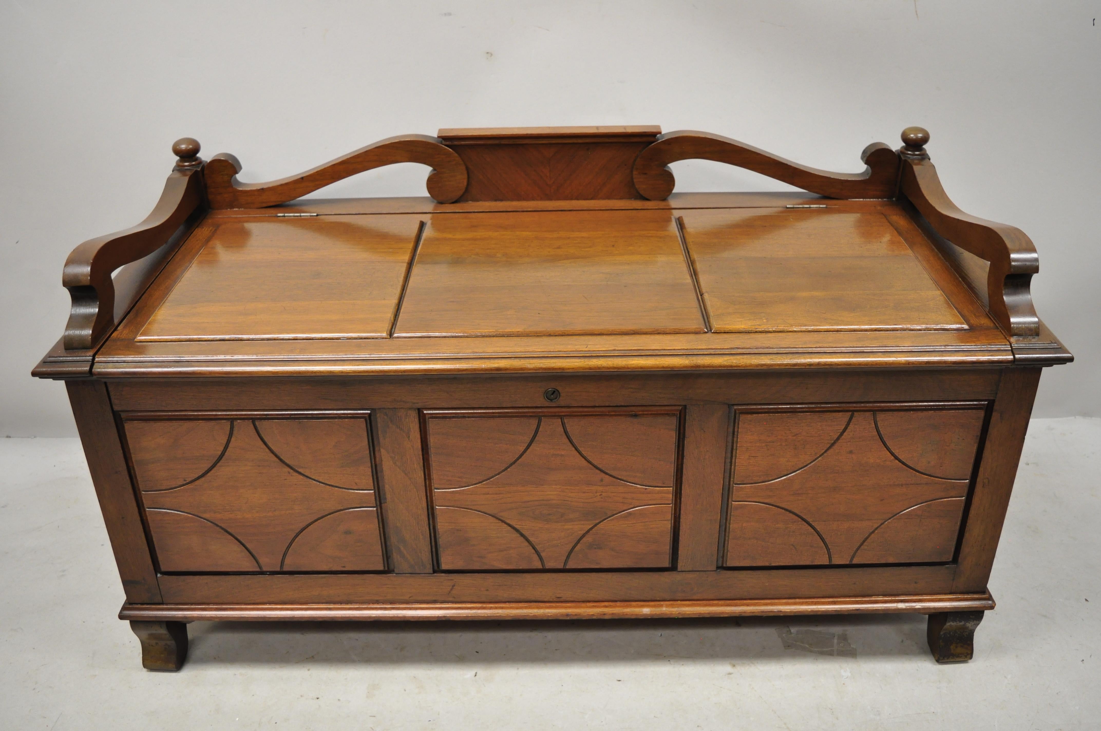Antique Jacobean depression walnut cedar chest blanket chest bench storage trunk. Item features cedar lined interior, raised panel front and sides, bench seat, solid wood construction, beautiful wood grain, nicely carved details, no key, but