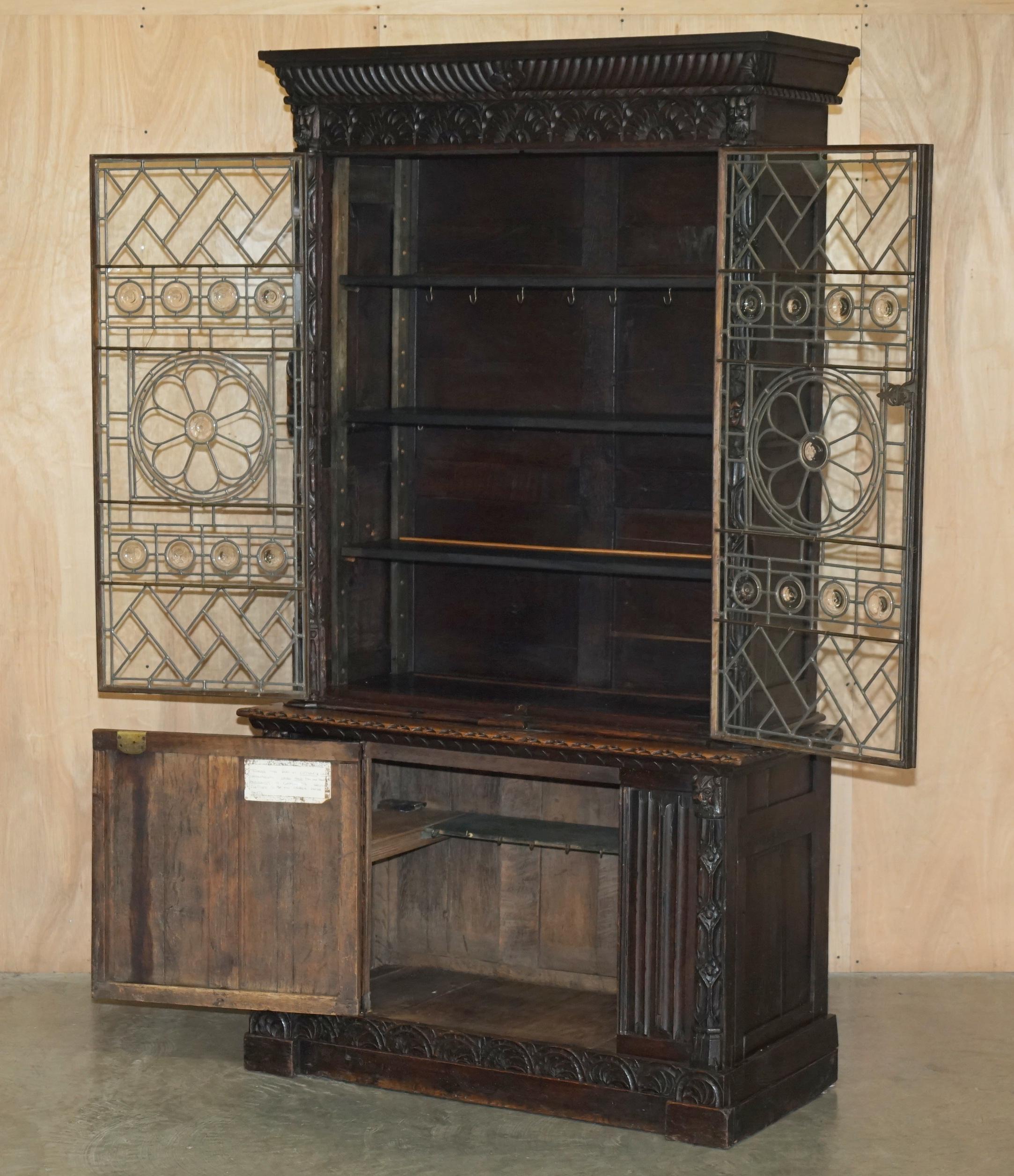 ANTiQUE JACOBEAN LINEN FOLD CARVED ZINC LINED ASTRAL GLAZED LIBRARY BOOKCASe For Sale 10