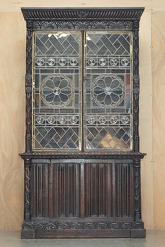 ANTiQUE JACOBEAN LINEN FOLD CARVED ZINC LINED ASTRAL GLAZED LIBRARY BOOKCASe