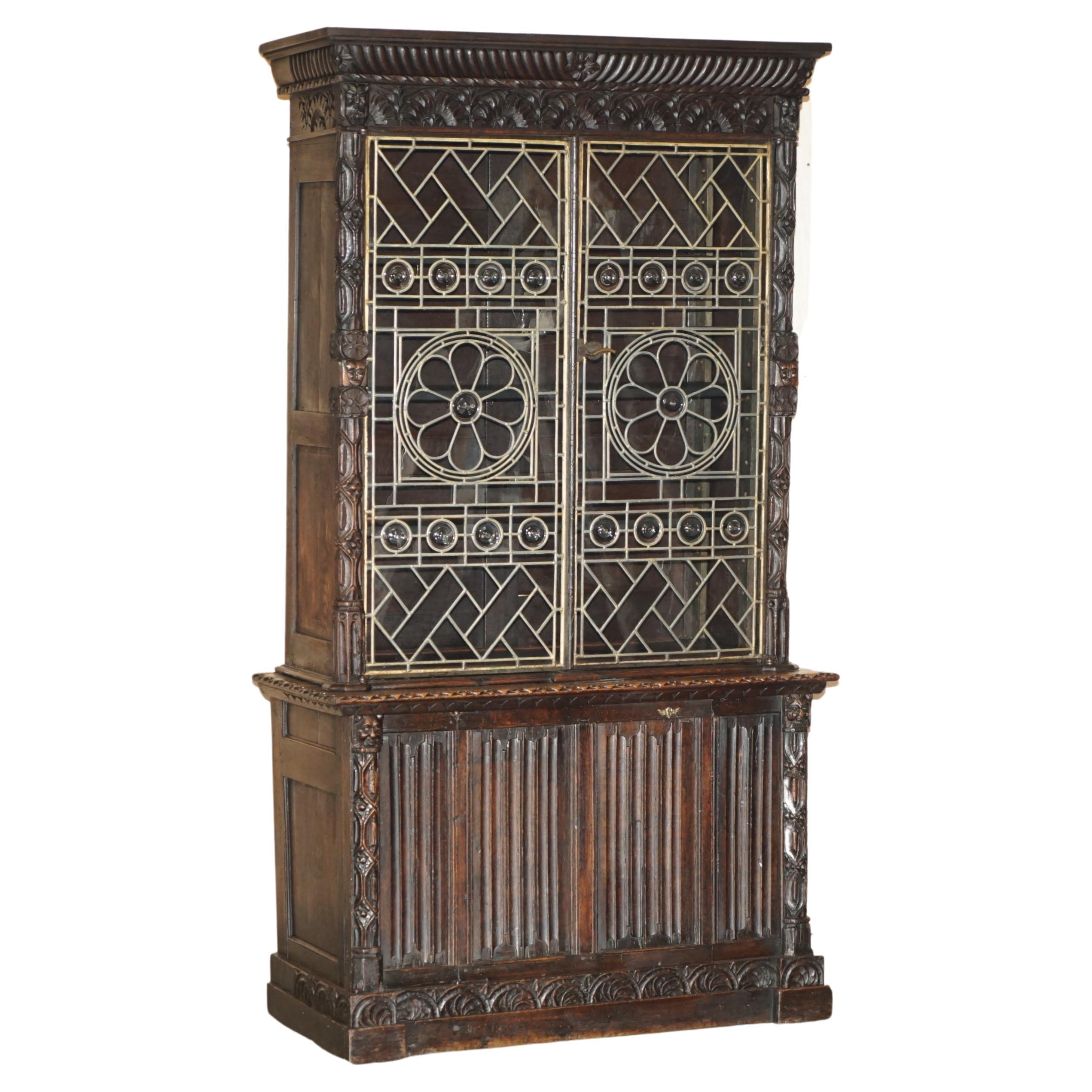 ANTiQUE JACOBEAN LINEN FOLD CARVED ZINC LINED ASTRAL GLAZED LIBRARY BOOKCASe For Sale