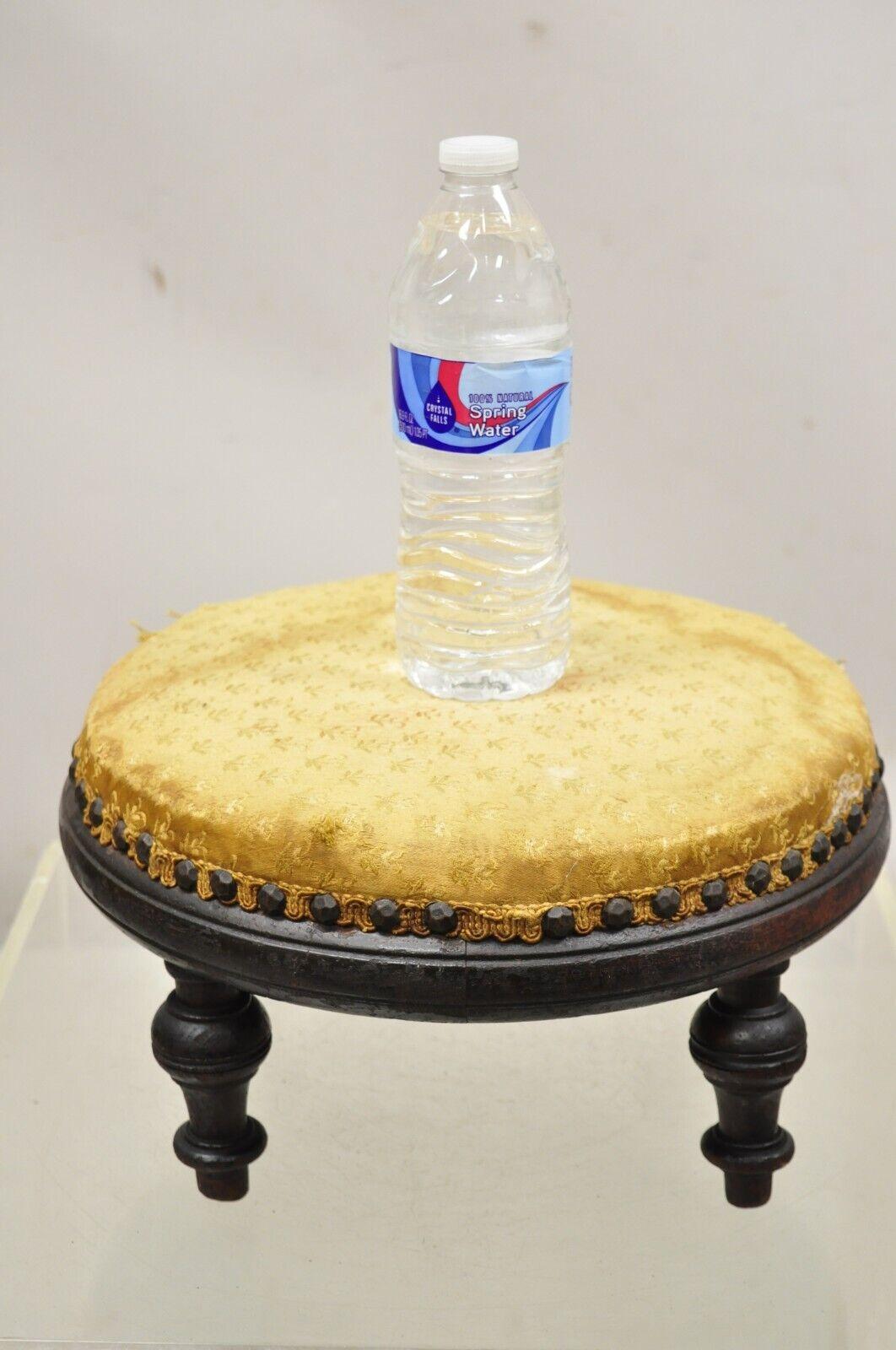 Antique Jacobean Mahogany Round Small Footstool Ottoman with Turn Carved Legs. Item features turn carved legs, round solid wood frame, very nice antique item, quality craftsmanship, great style and form circa Early 1900s. Measurements: 6.5