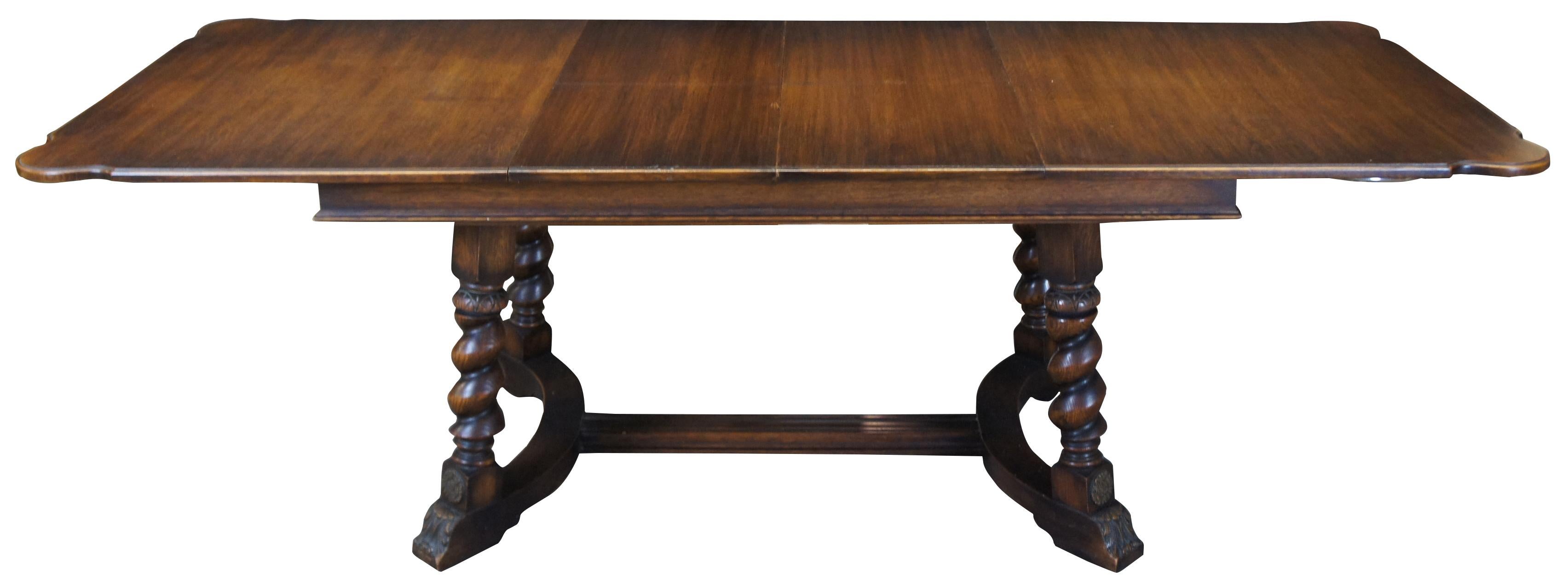 Early 20th century Jacobean inspired dining table. Made from oak with a rectangular top with rounded corners. Over four turned barley twist legs, leading to an acanthus feet connected by H stretcher / trestle base. The table expands with a unique