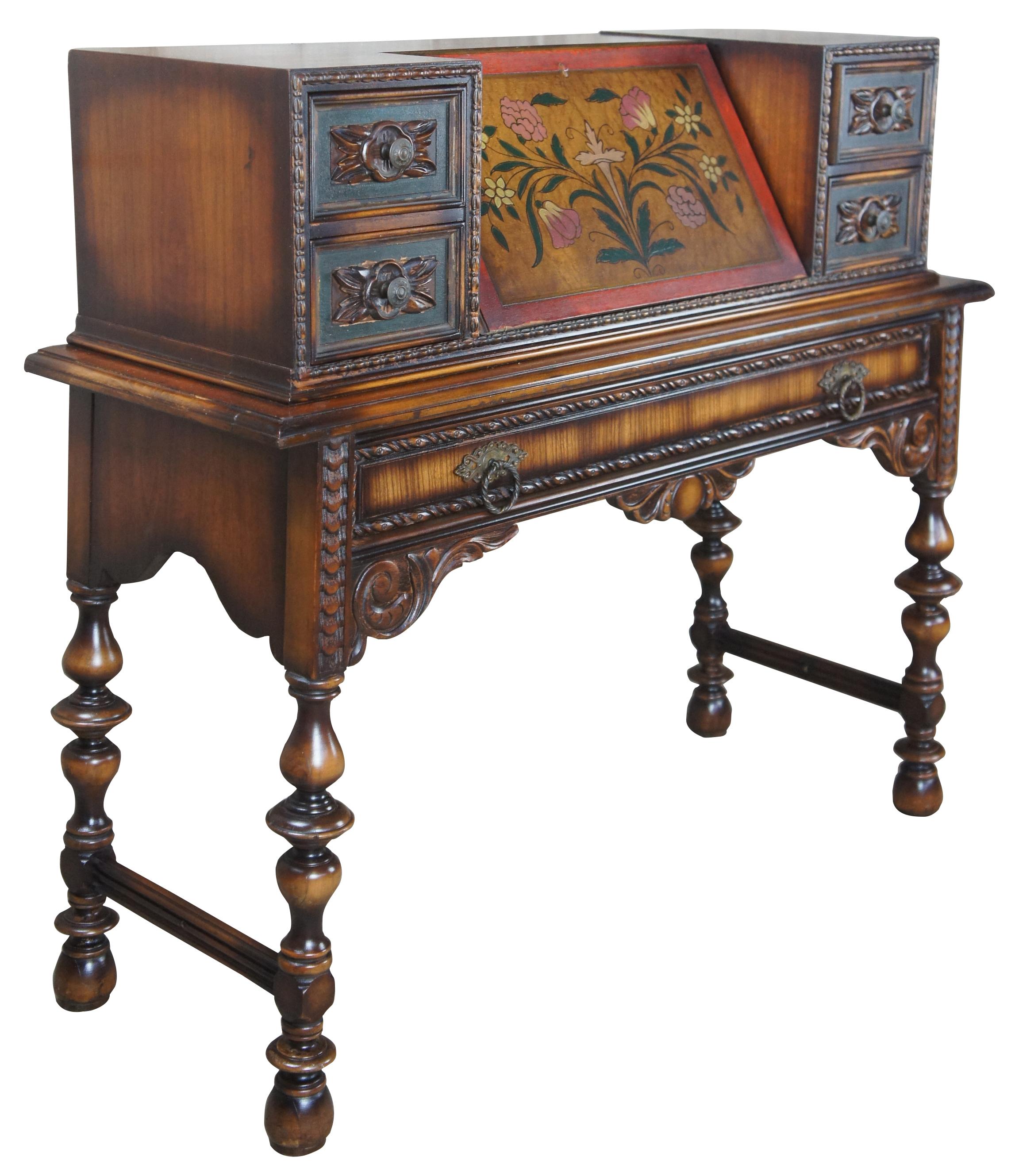 20th century Jacobean / Spanish Revival secretary desk. Made from walnut with hand carved and painted detail. Features five drawers and interior cubbies for storage. Attributed to Berkey and Gay Furniture Co. of Grand Rapids Michigan.
   