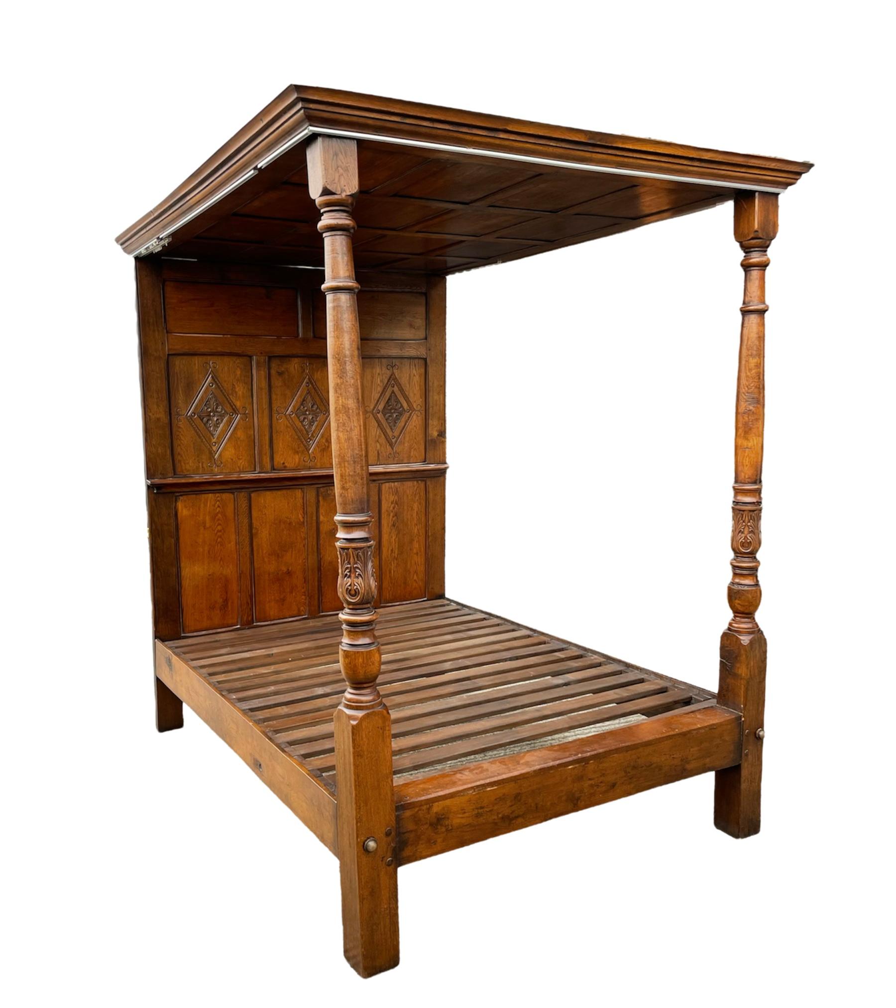 Fine quality carved oak four poster king size bed in the Jacobean style circa 1920 .
The bed is constructed of solid oak through out ,it has a fine lozenge carved panelled head board with a wonderful panelled oak canopy top with fine carved column