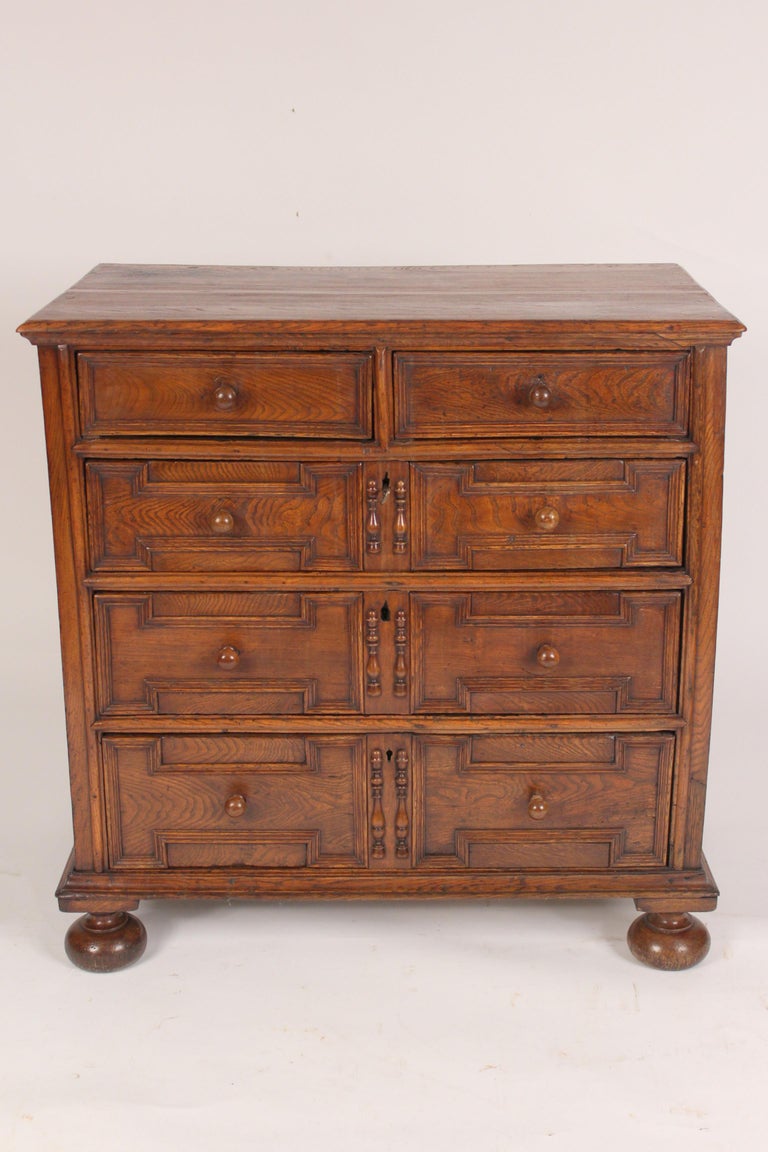 Antique Jacobean style oak chest of drawers, early 19th century.