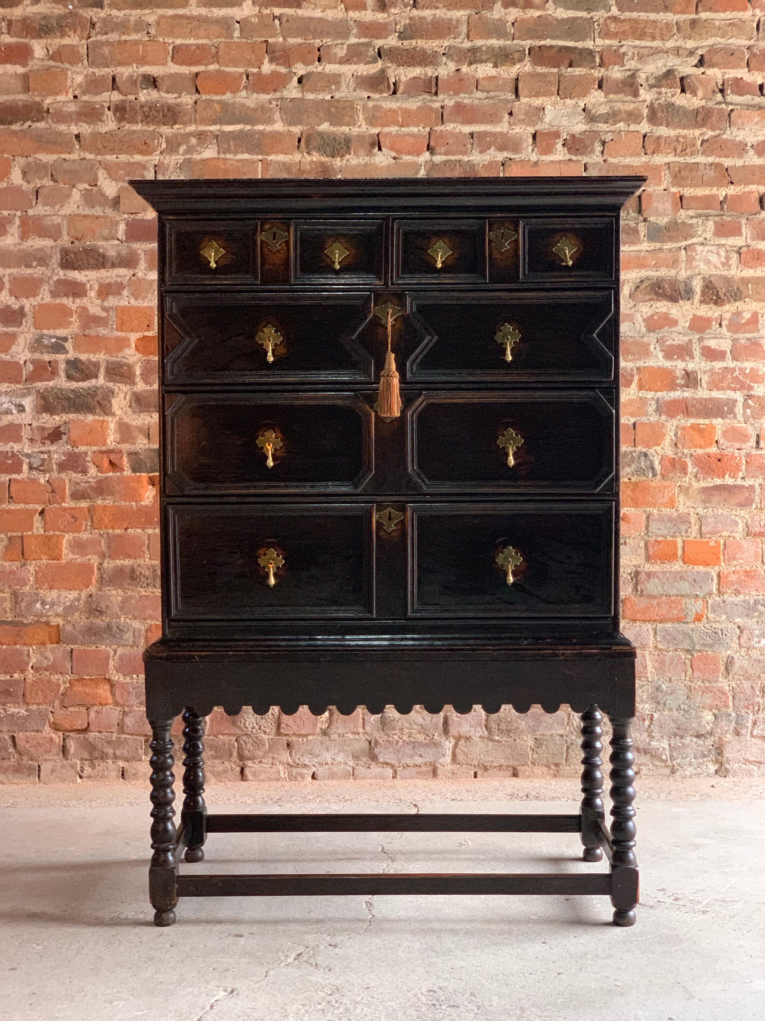 Antique Jacobean style oak chest on stand 19th century circa 1890

Antique Jacobean style solid oak chest on stand 19th century circa 1890, the rectangular corniced top over two short and three long graduated drawers with applied moulded detail