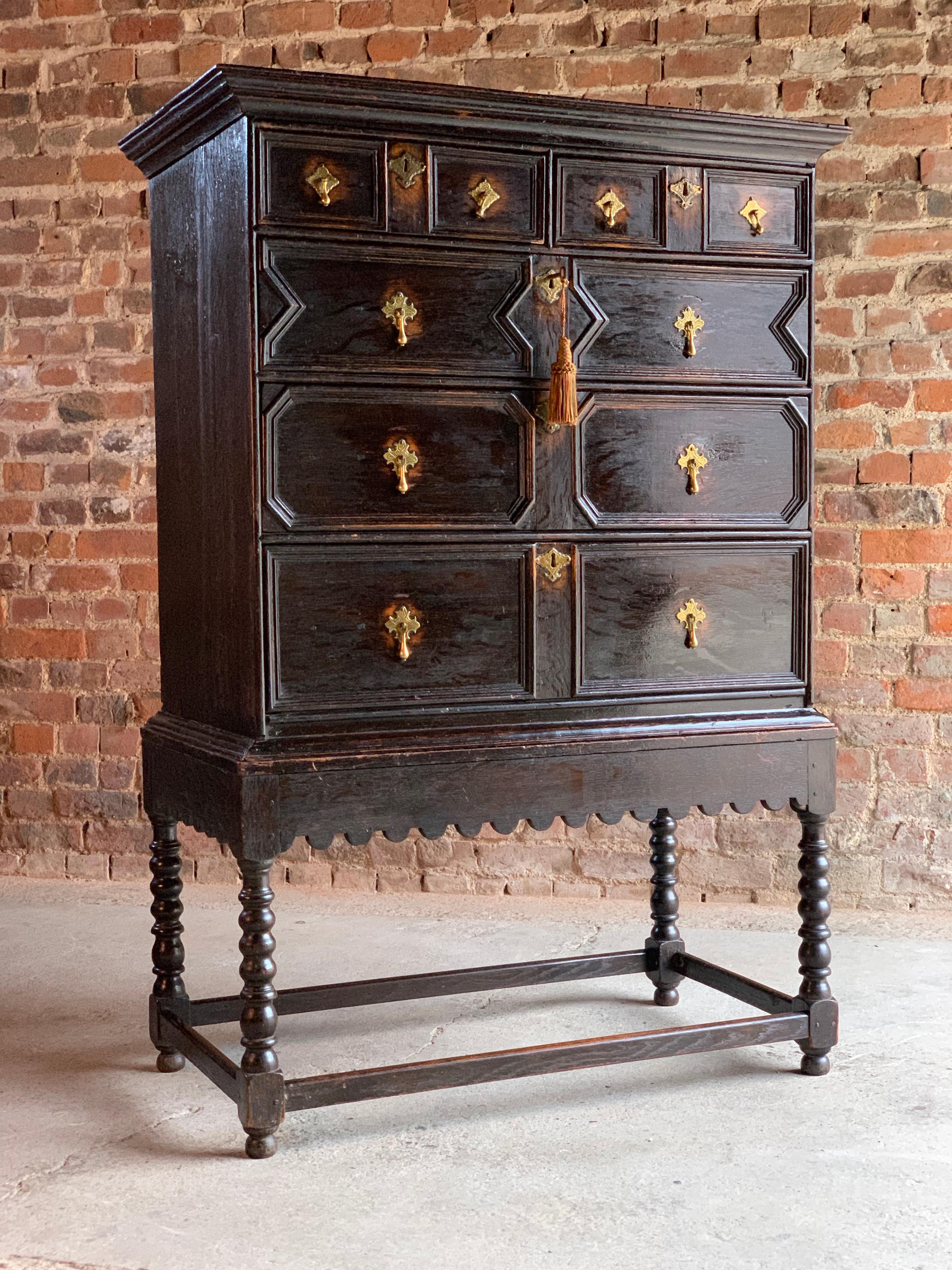 Antique Jacobean style oak chest on stand 19th century, circa 1890

Antique Jacobean style solid oak chest on stand 19th century circa 1890, the rectangular corniced top over two short and three long graduated drawers with applied moulded detail