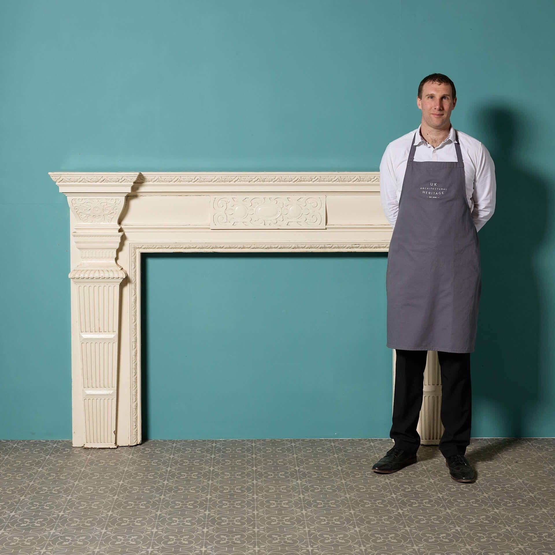 An antique Jacobean style pine and composition fire mantel reclaimed from a property in Surrey., UK. Dating to circa 1880, this fireplace displays an elegant design with a beautiful white painted finish.
A perfect feature for traditional townhouses