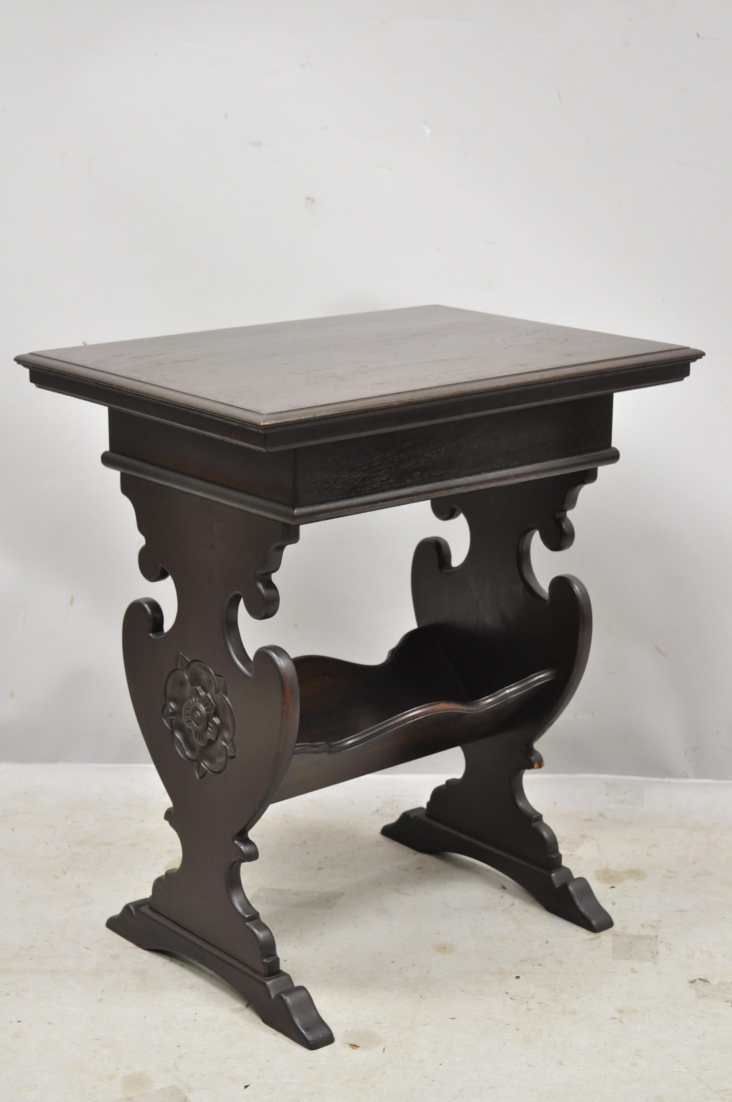 Antique Jacobean trestle style flip storage top work stand side end table. Item features flip storage top, lower storage area, solid wood construction, beautiful wood grain, nicely carved details, very nice antique item, great style and form, circa