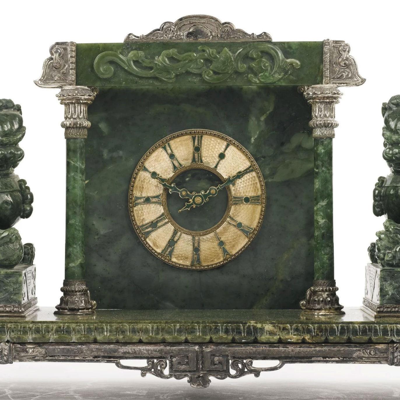 Our lovely portico style mantel clock, retailed by Yamanaka & Company Ltd. in New York in the early 20th century, features a silverplate frame flanked by two finely carved foo lions and movement by the Chelsea Clock Company. 23 in wide, 11 1/2 in