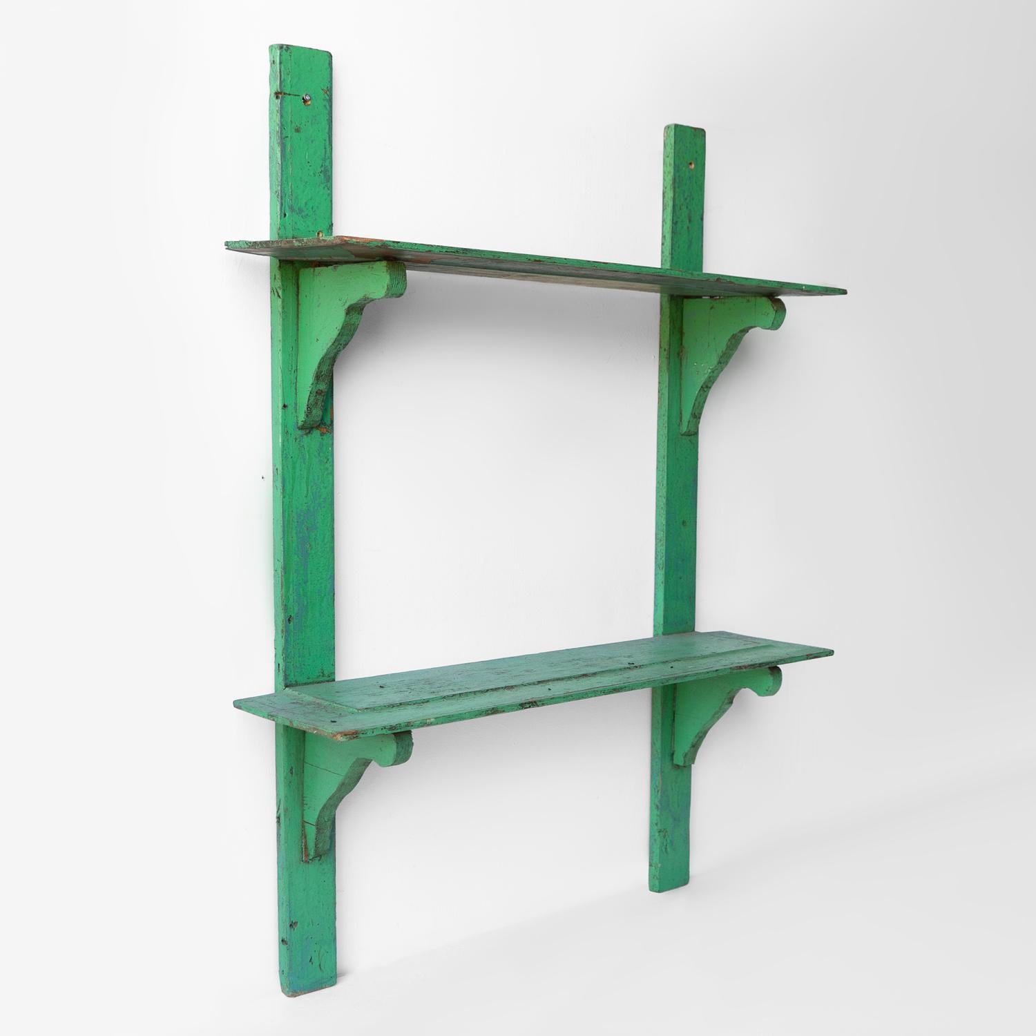 WALL MOUNTED SHELF

Two shelves with decorative shaped brackets.

Probably dating from the early 20th Century.

At some point in their life have been painted with a vibrant jade green paint.

They are in good vintage order with some minor cosmetic