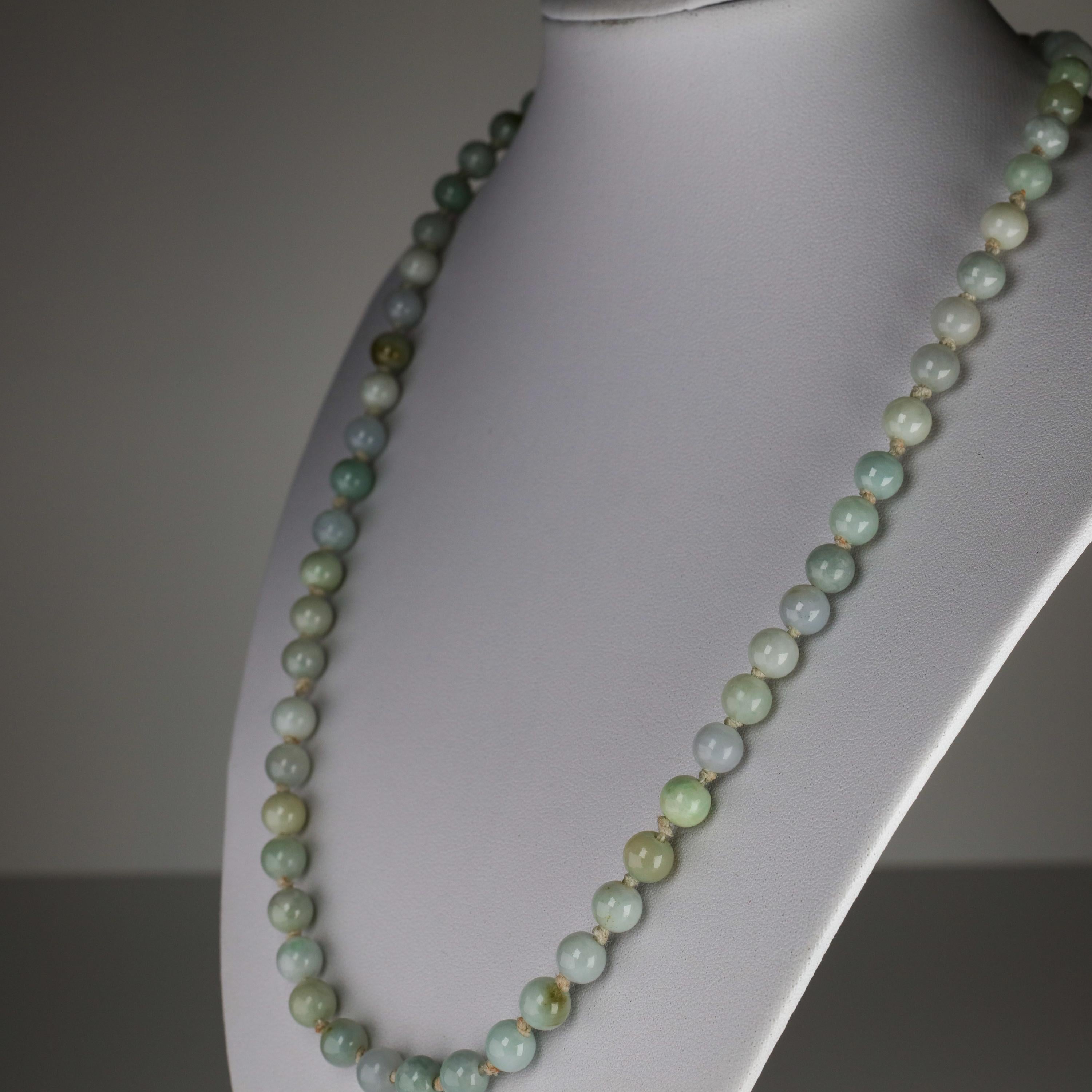 Tender blues, soft yellows, pale greens, misty whites: presenting an antique jadeite jade necklace in the softest, most delicate palate. The sixty hand-carved beads are highly polished and translucent; their delicate coloring is bleached in bright