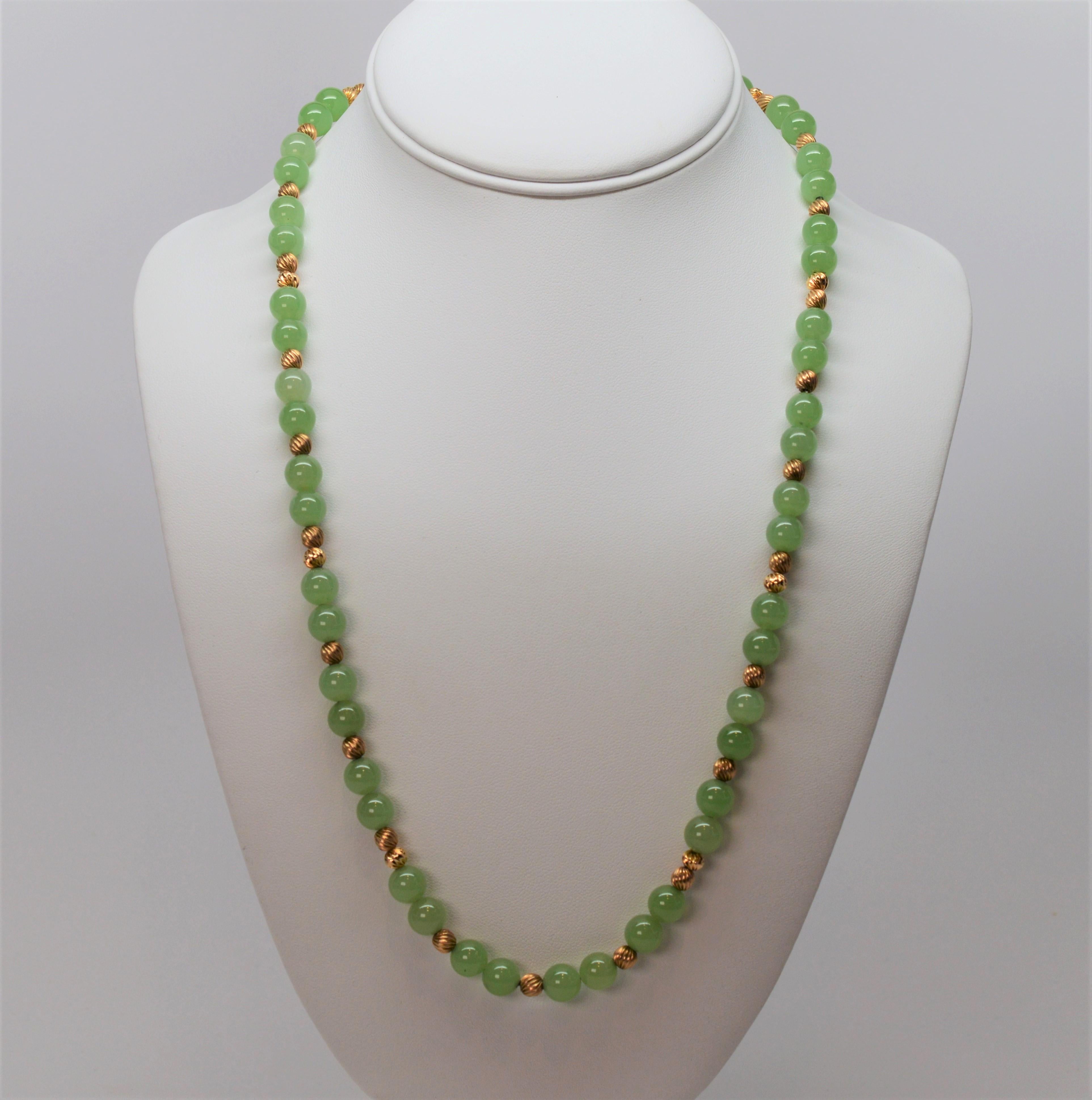Antique Jadeite & 14 Karat Yellow Gold Beaded Necklace from the Susan VanGilder Estate Collection. Fifty-two 8-1/4mm natural, translucent soft moss green Jadeite beads are accented by thirty-three 5mm swirled finished 14K Antique Gold Beads to