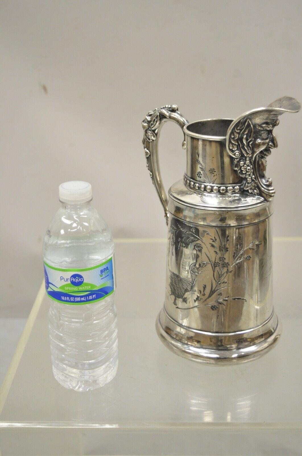 Antique James W. Tufts Renaissance Bacchus Silverplated Water Wine Pitcher. Item features engraved 