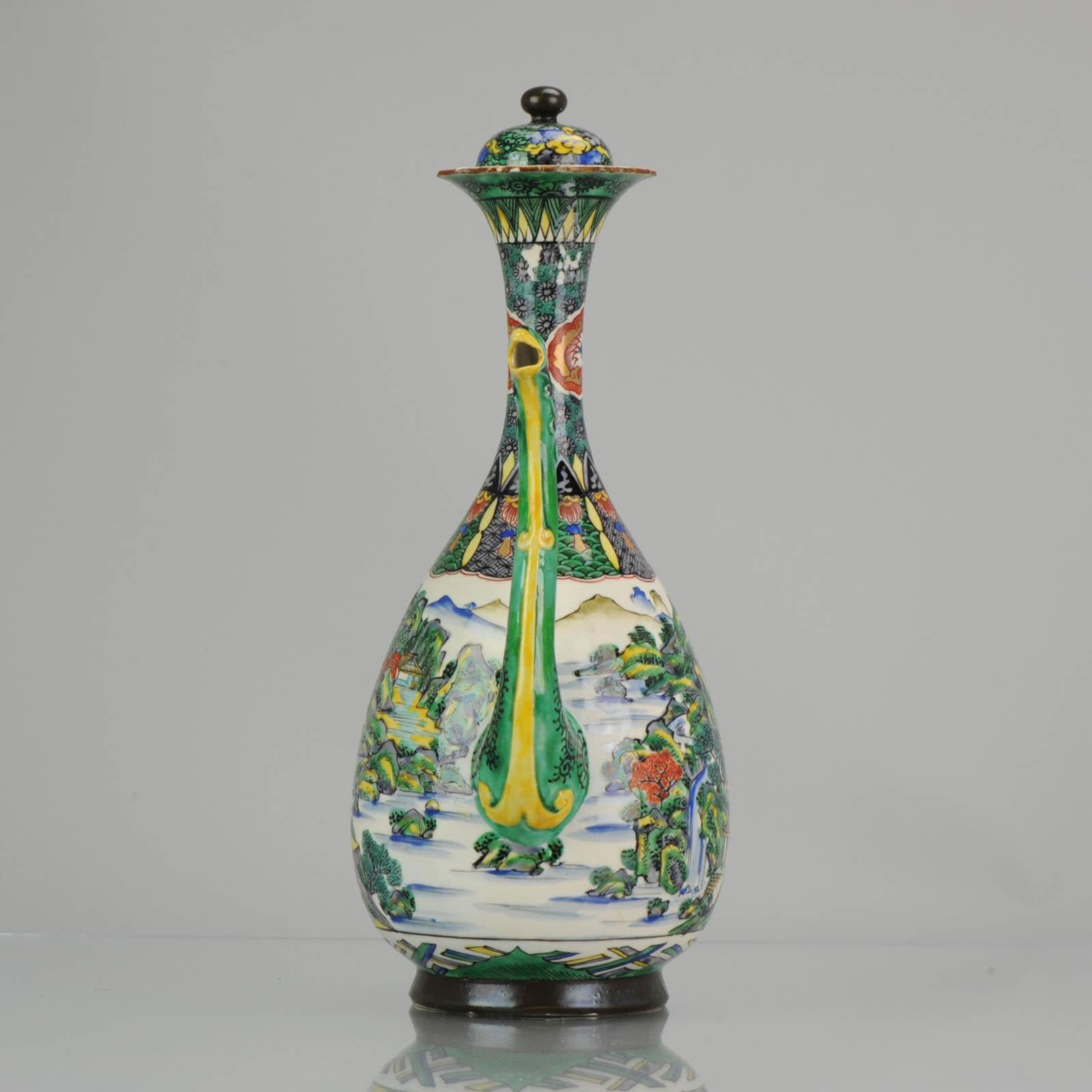 Lovely Japanese porcelain ewer in nice green enamels. Amazing piece with dragon handle and bird spout. Marked at the base.
Condition
Overall condition handle and spout are restored, some stick remainings to neck and lid. Size 320mm high and 205mm