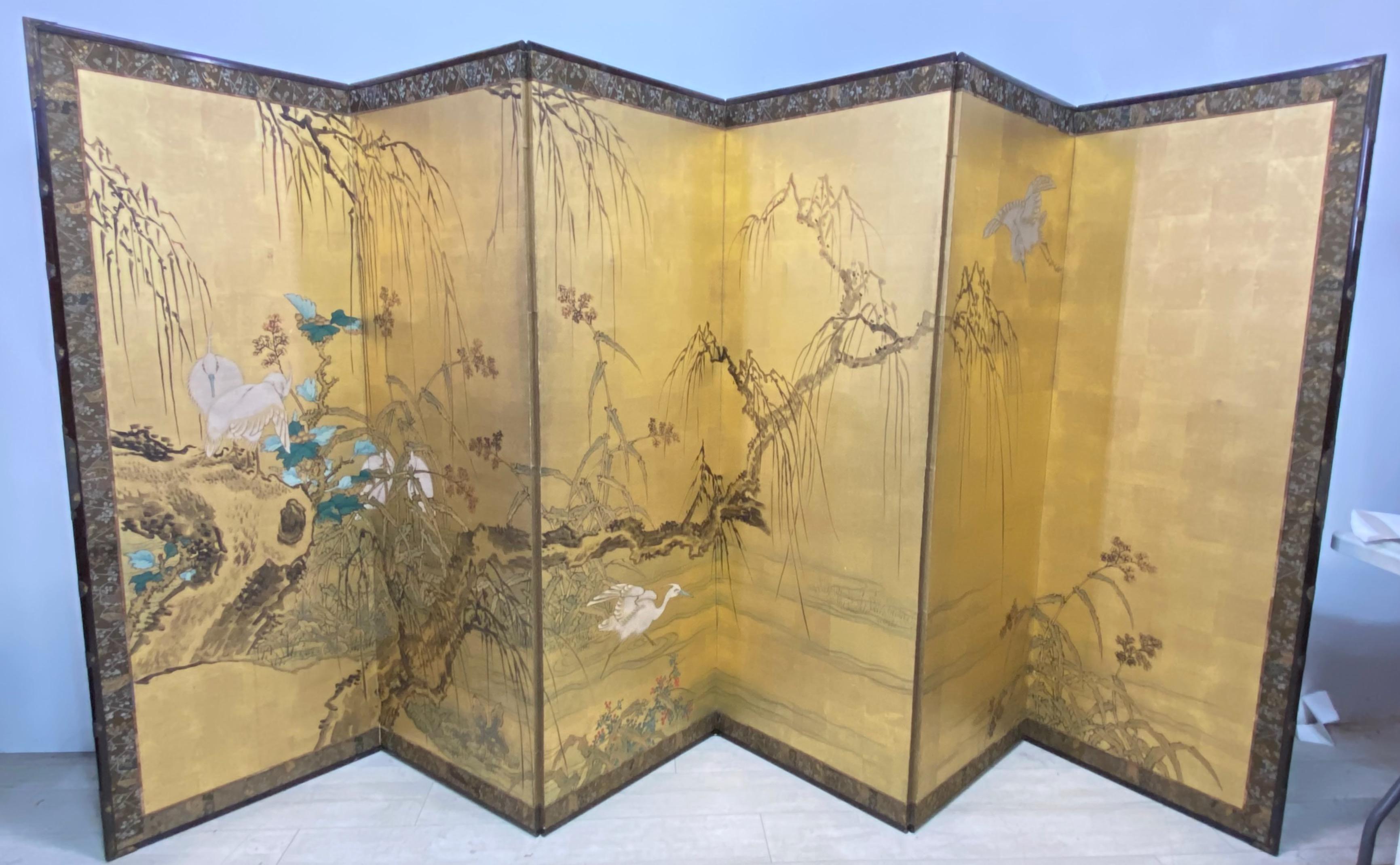 Japanese 6 panel folding screen, Meiji period circa 1900. 
Gold leaf on mulberry paper with landscape scene hand painted in mineral pigments, having a silk brocade border and bronze mounts.
Late 19th - Early 20th century.



 