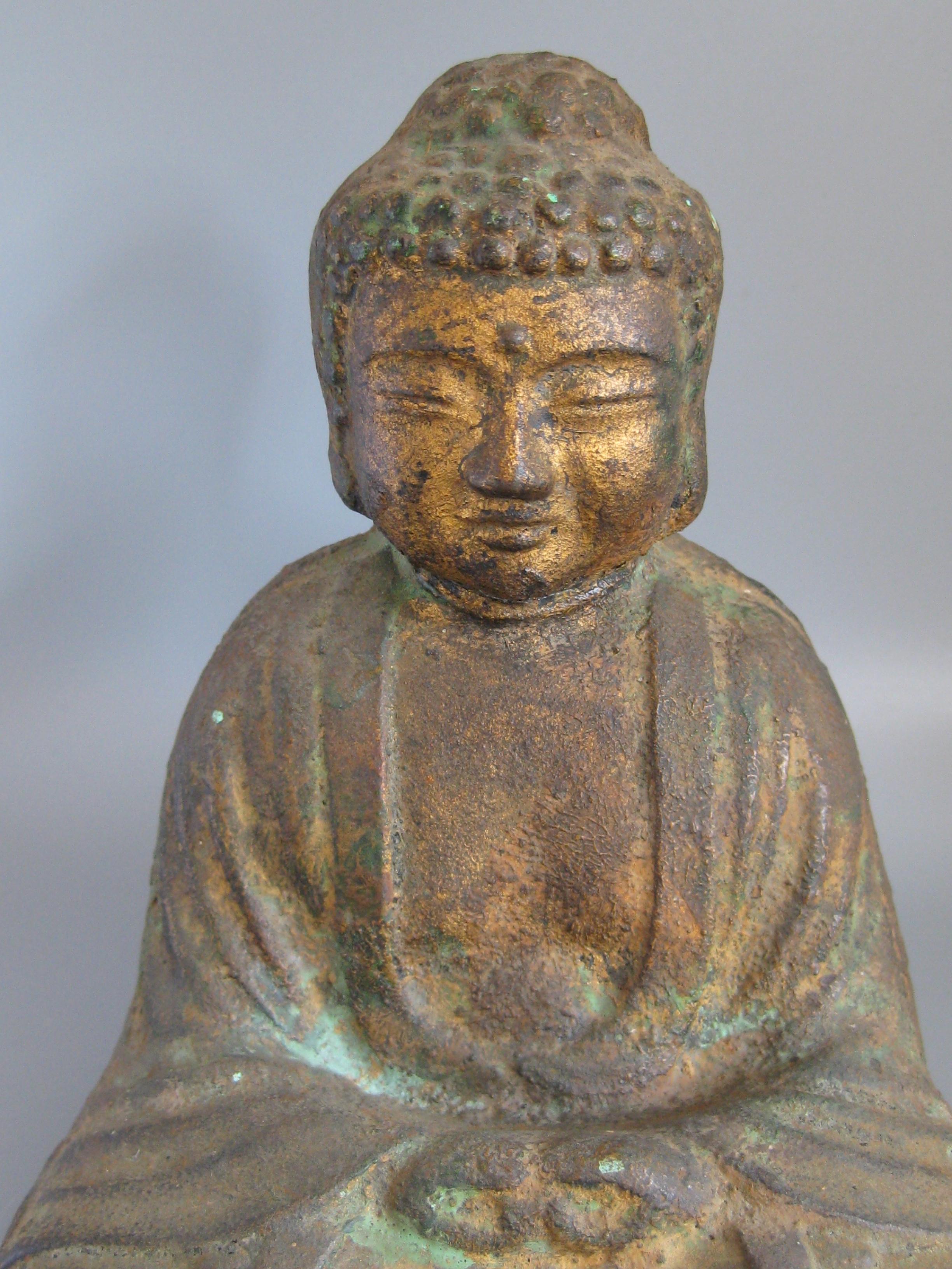 An outstanding antique Japanese Amida Buddha after Kamakura cast iron statue/sculpture. Has the remainder of the original hand painted gold gilt on the surface. Great details and form. This is a very old piece and is from an estate of the founder of