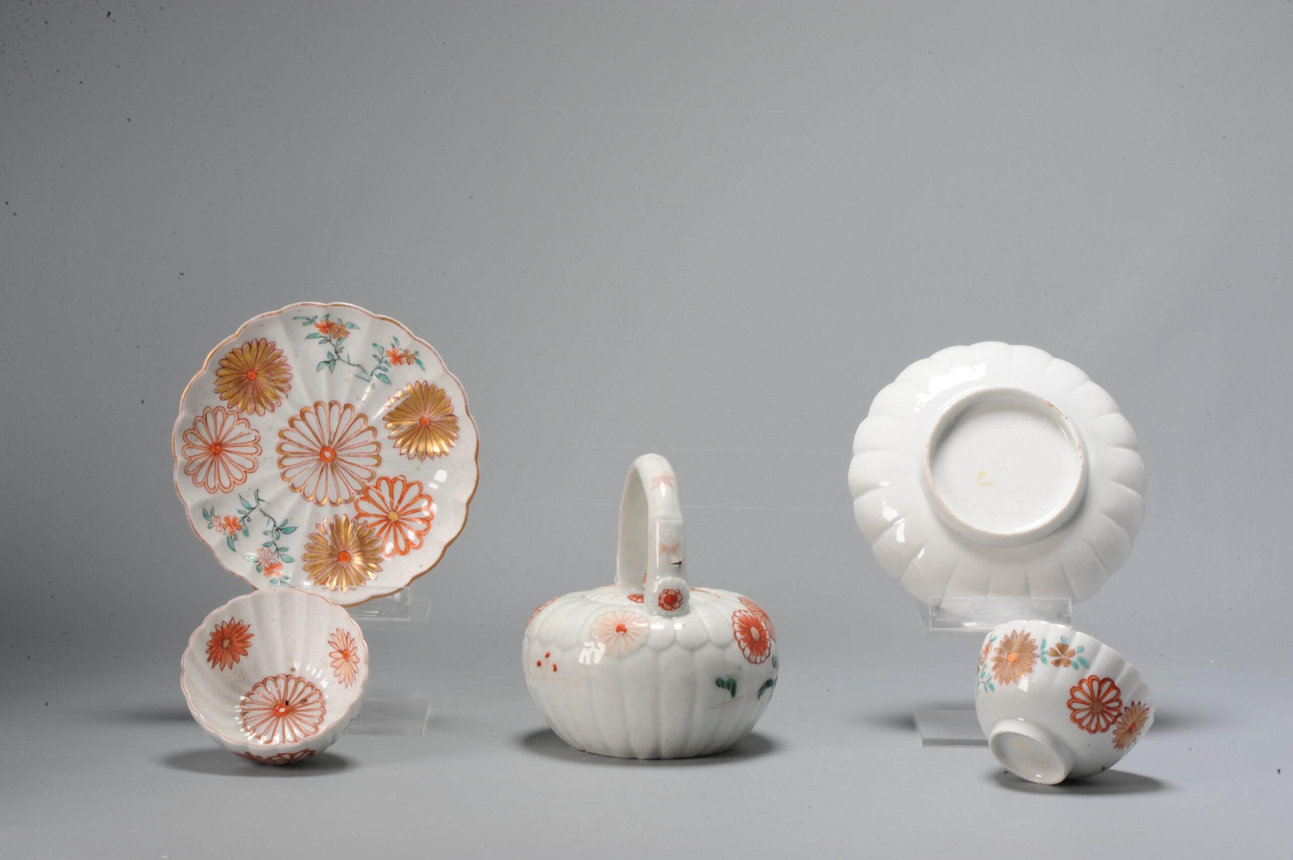 A lovely set of a teapot and 2 teabowls and saucers. Of moulded shape and with floral decoration. The bowls have hidden decoration in the wall of flowers.

Additional information:
Material: Porcelain & Pottery
Region of Origin: Japan
Period: