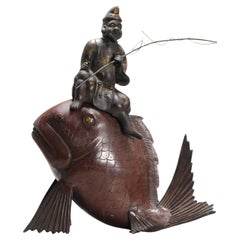 Brûleur d'encens japonais ancien en bronze et cuivre représentant un pêcheur sur un poisson
