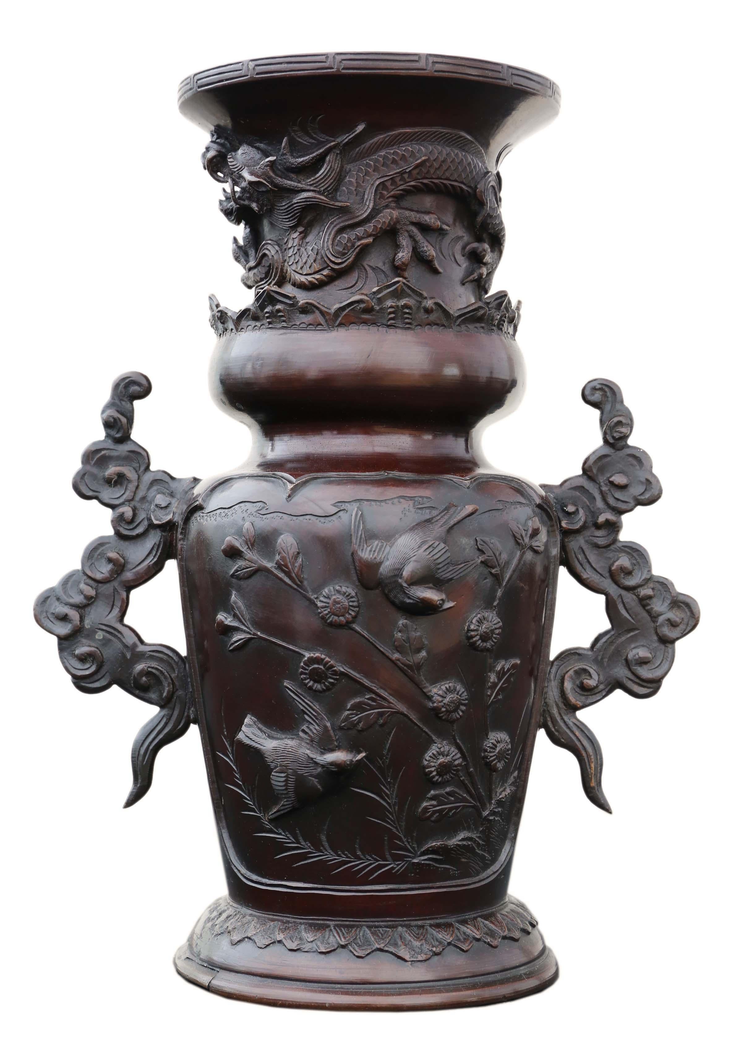 Early Japanese Meiji period bronze vase. Raised dragon with birds and cloud handles.
Would look amazing in the right location. The very best color and patina. Exudes quality.
Overall maximum dimensions: ~30cm high x 24cm diameter across handles